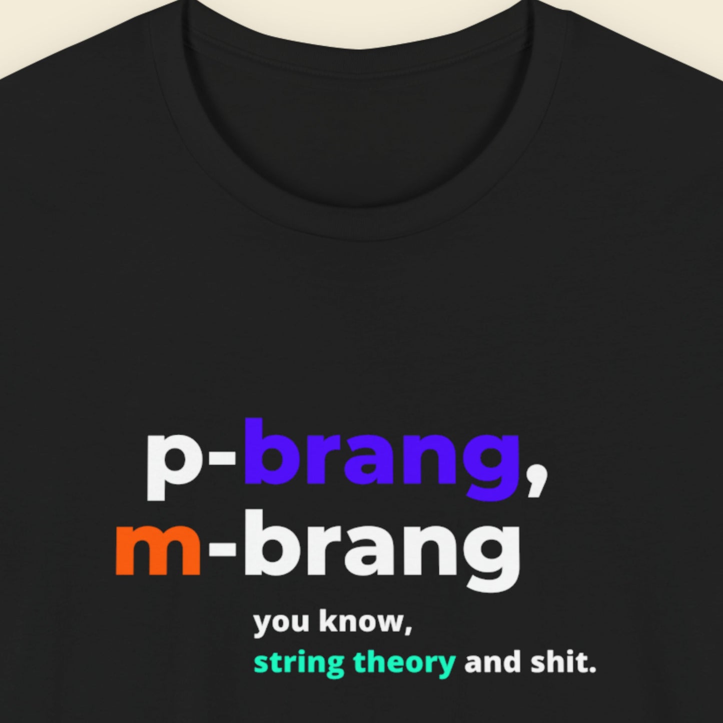 Black t-shirt with colorful text design on a beige background.
