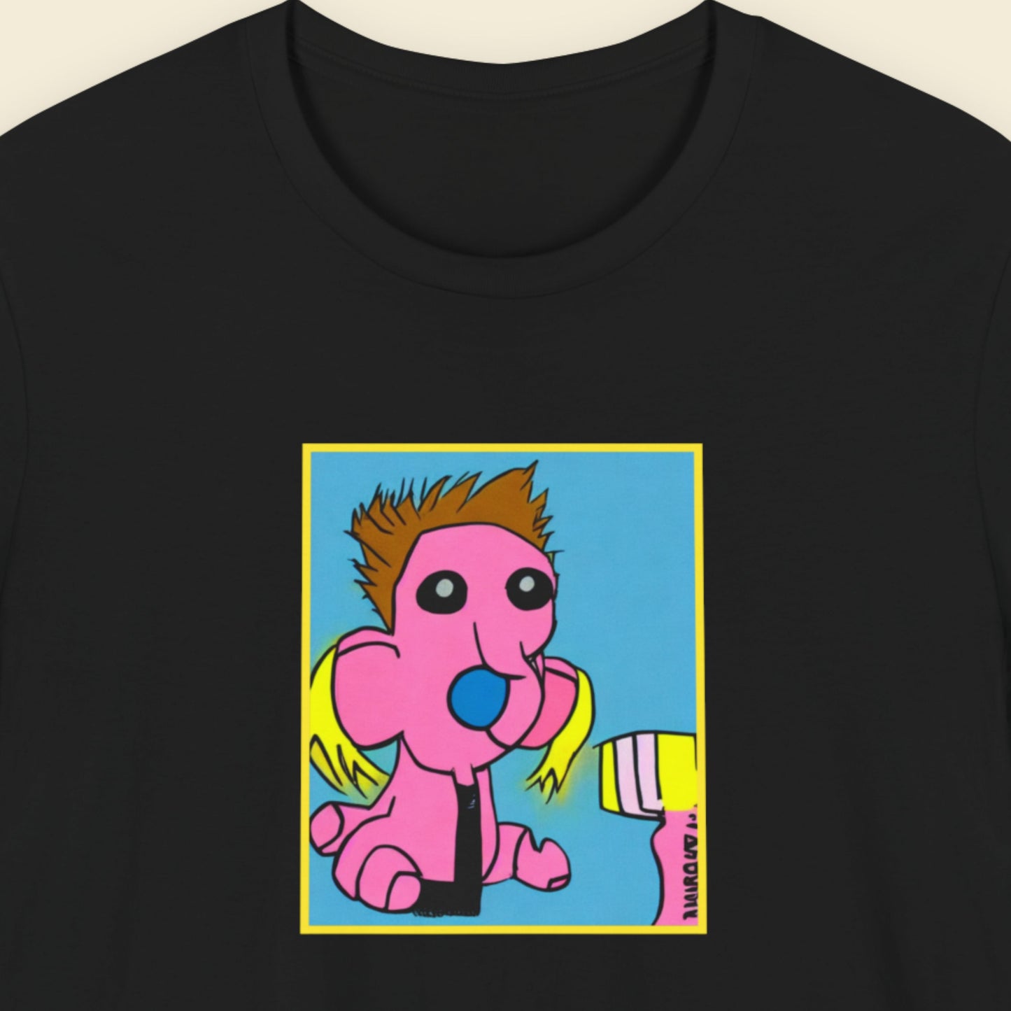 Black t-shirt with a fun, colorful cartoon illustration on a beige background.