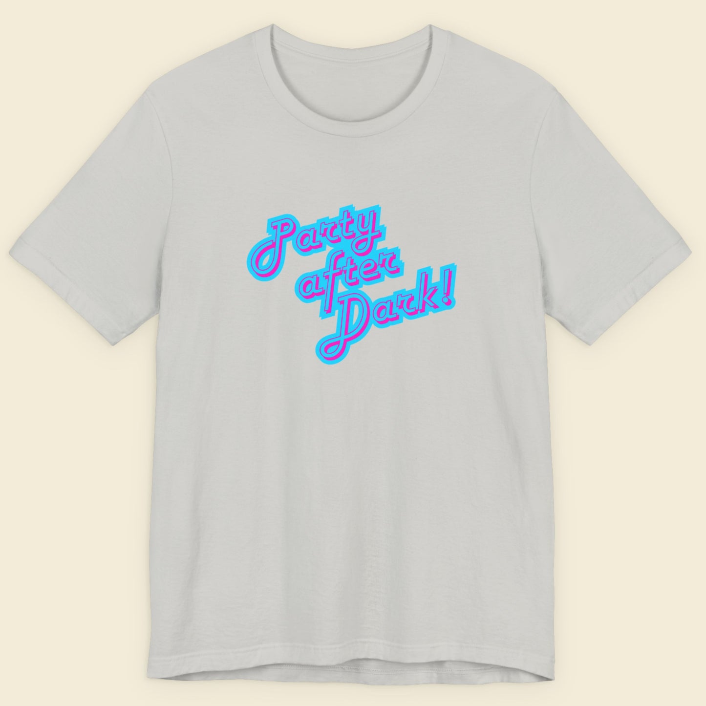 Light grey t-shirt with humorous colorful text on a beige background.