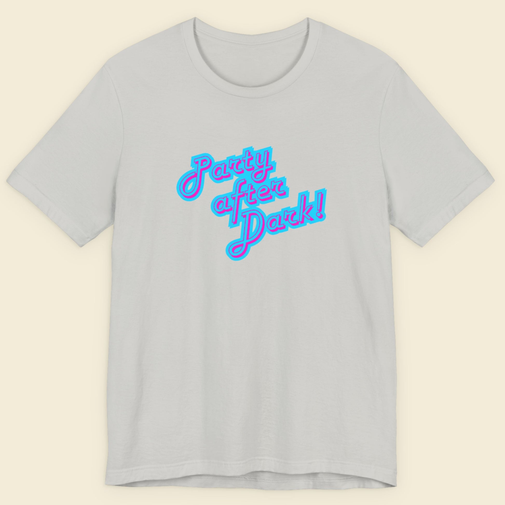 Light grey t-shirt with humorous colorful text on a beige background.