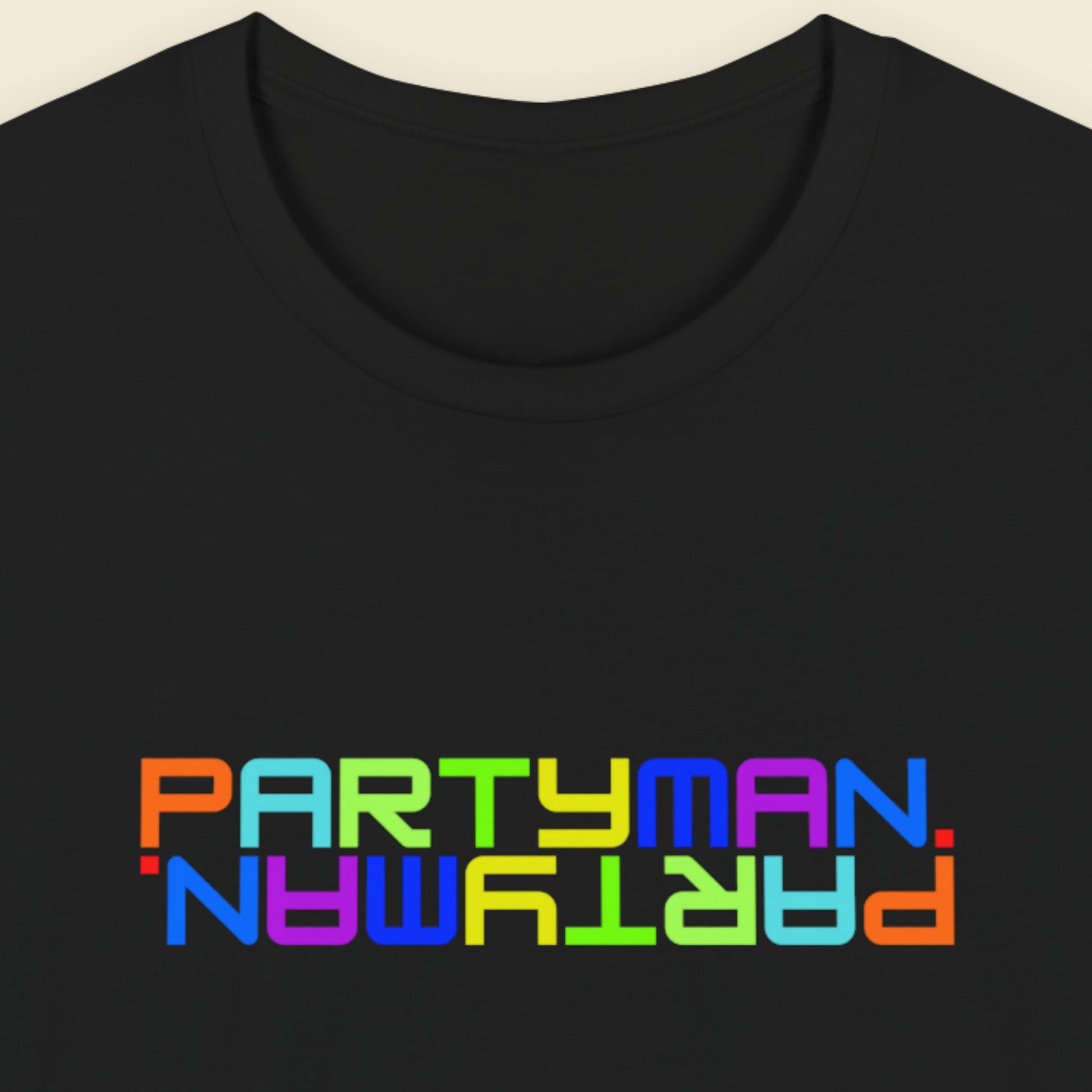 Black t-shirt with 'PARTYMAN' in colorful letters on a beige background.