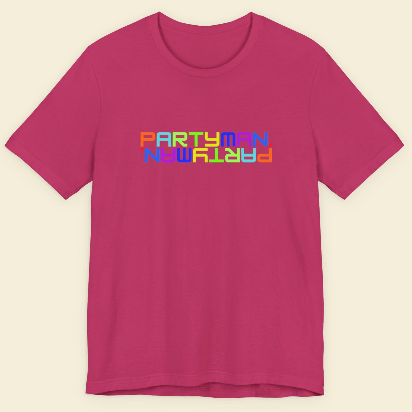 Pink t-shirt with 'PARTYMAN' text in colorful letters on a beige background.