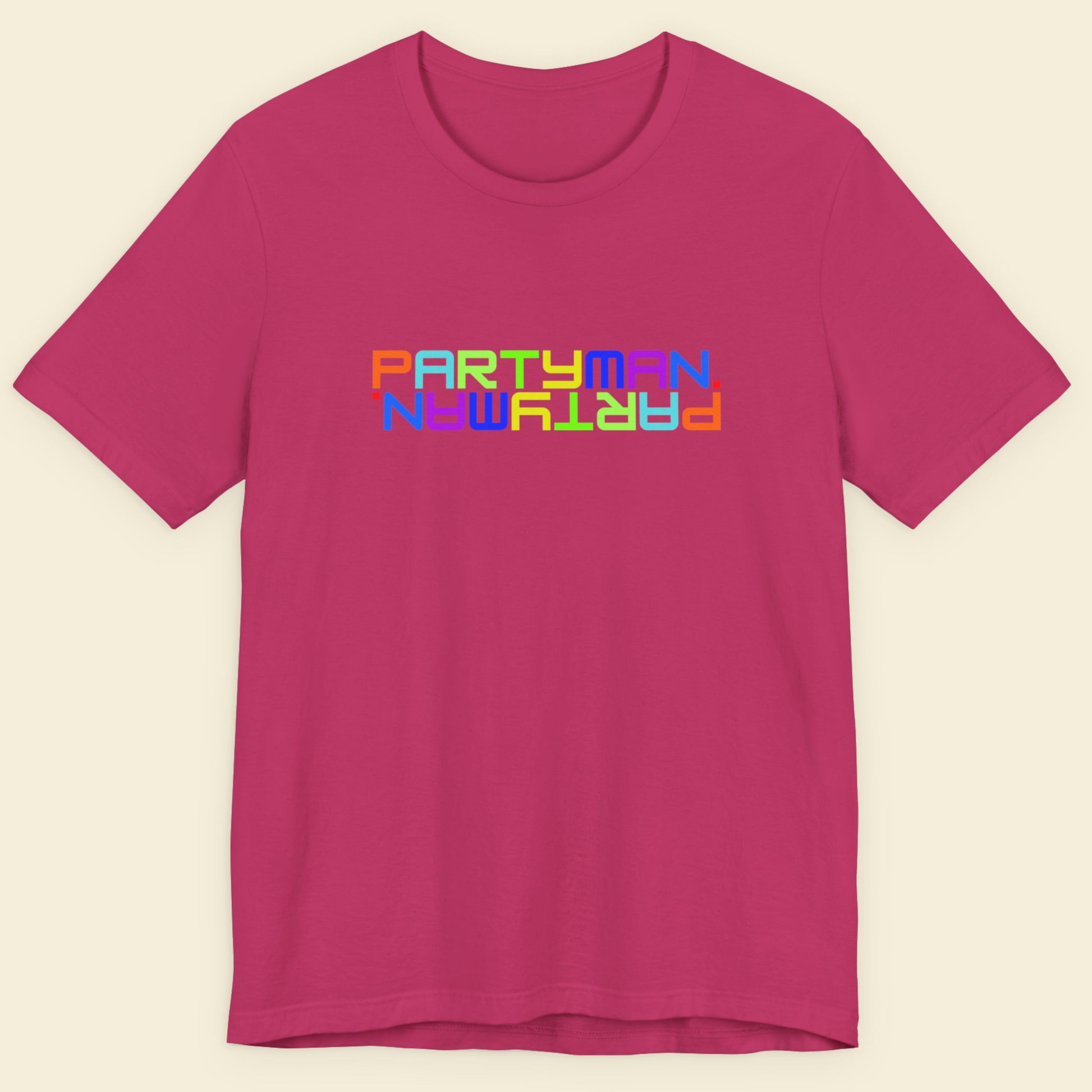 Pink t-shirt with 'PARTYMAN' text in colorful letters on a beige background.