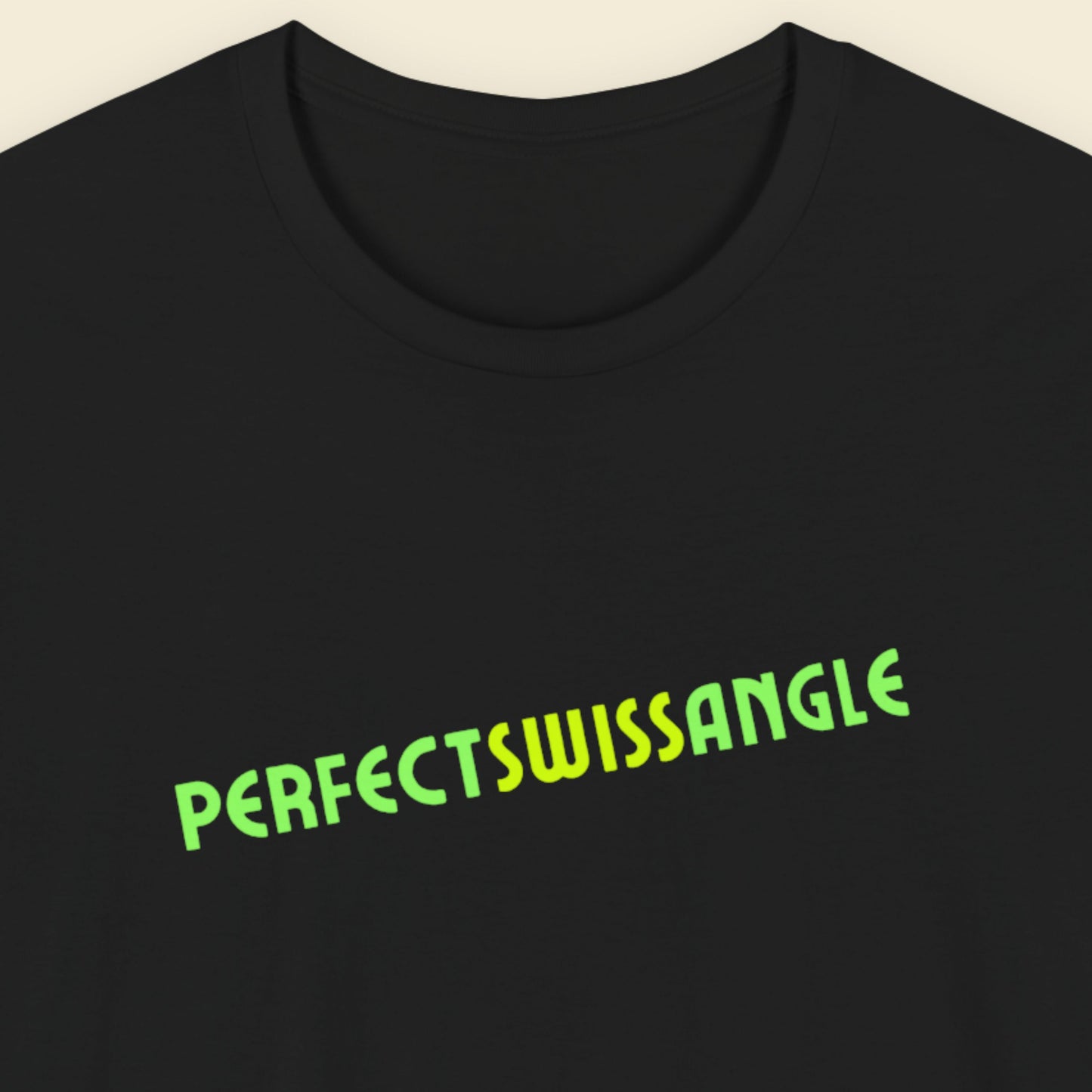 Black t-shirt with humorous colorful text on a beige background.