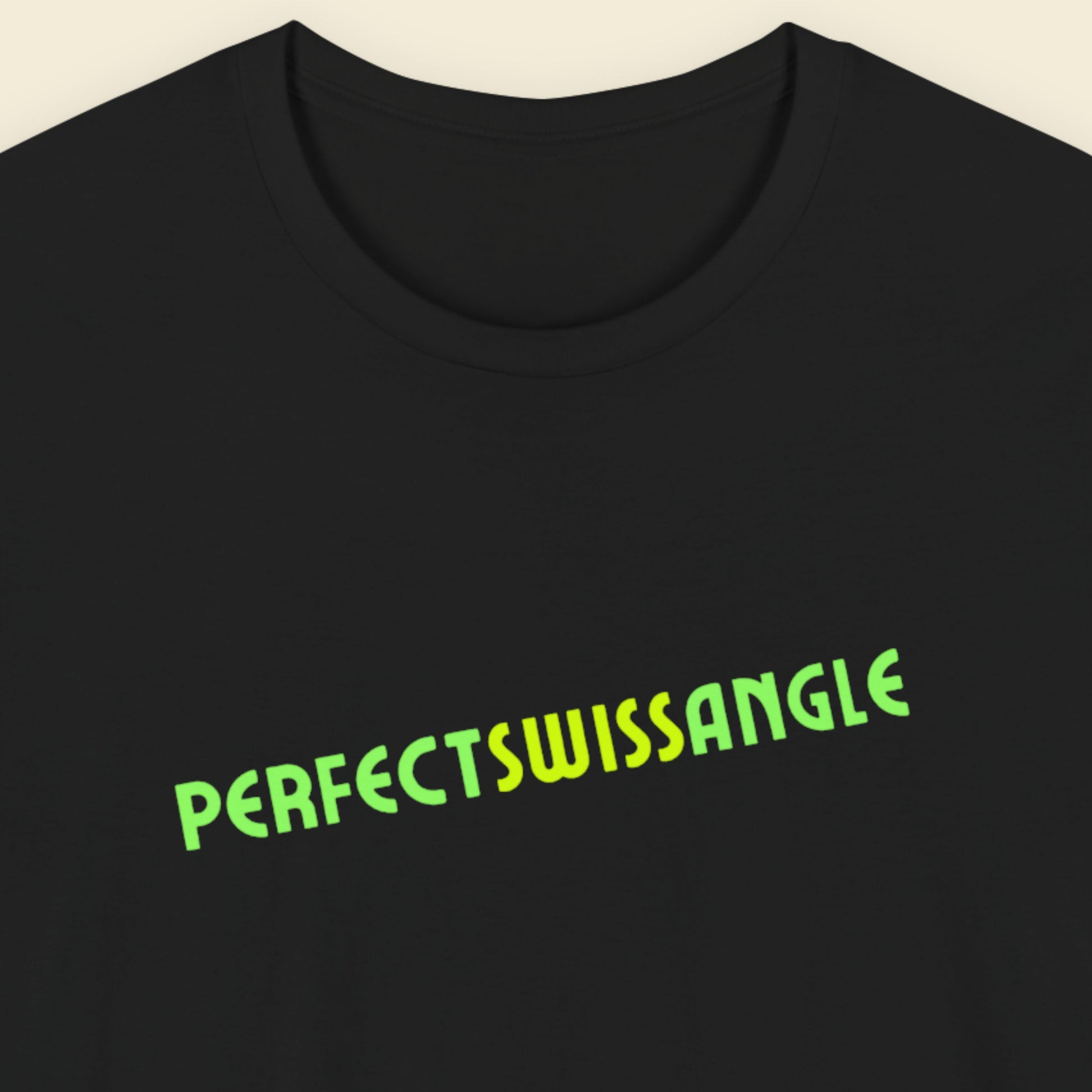 Black t-shirt with humorous colorful text on a beige background.