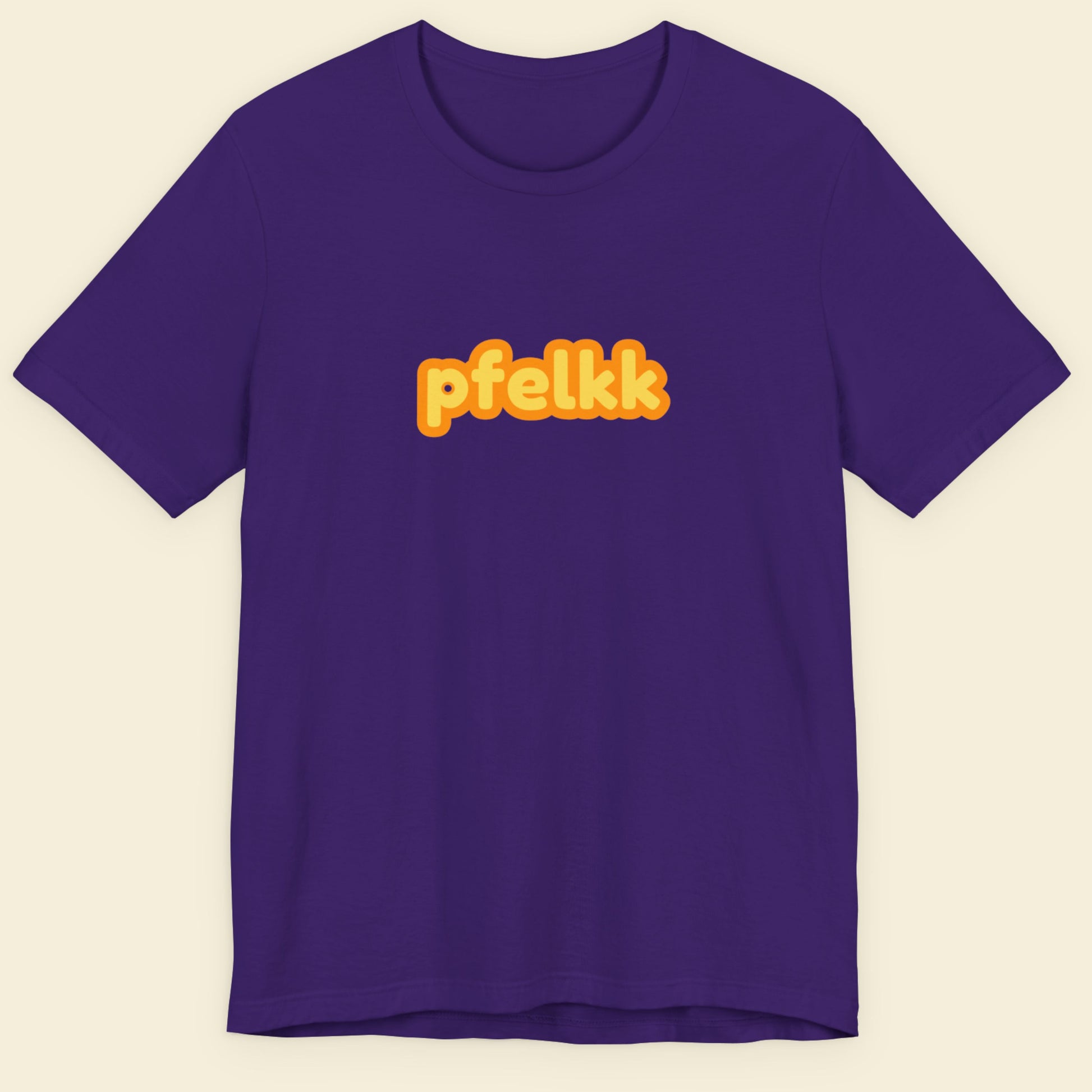 Navy blue tee with multicolored 'pfelkk' text on a beige background.