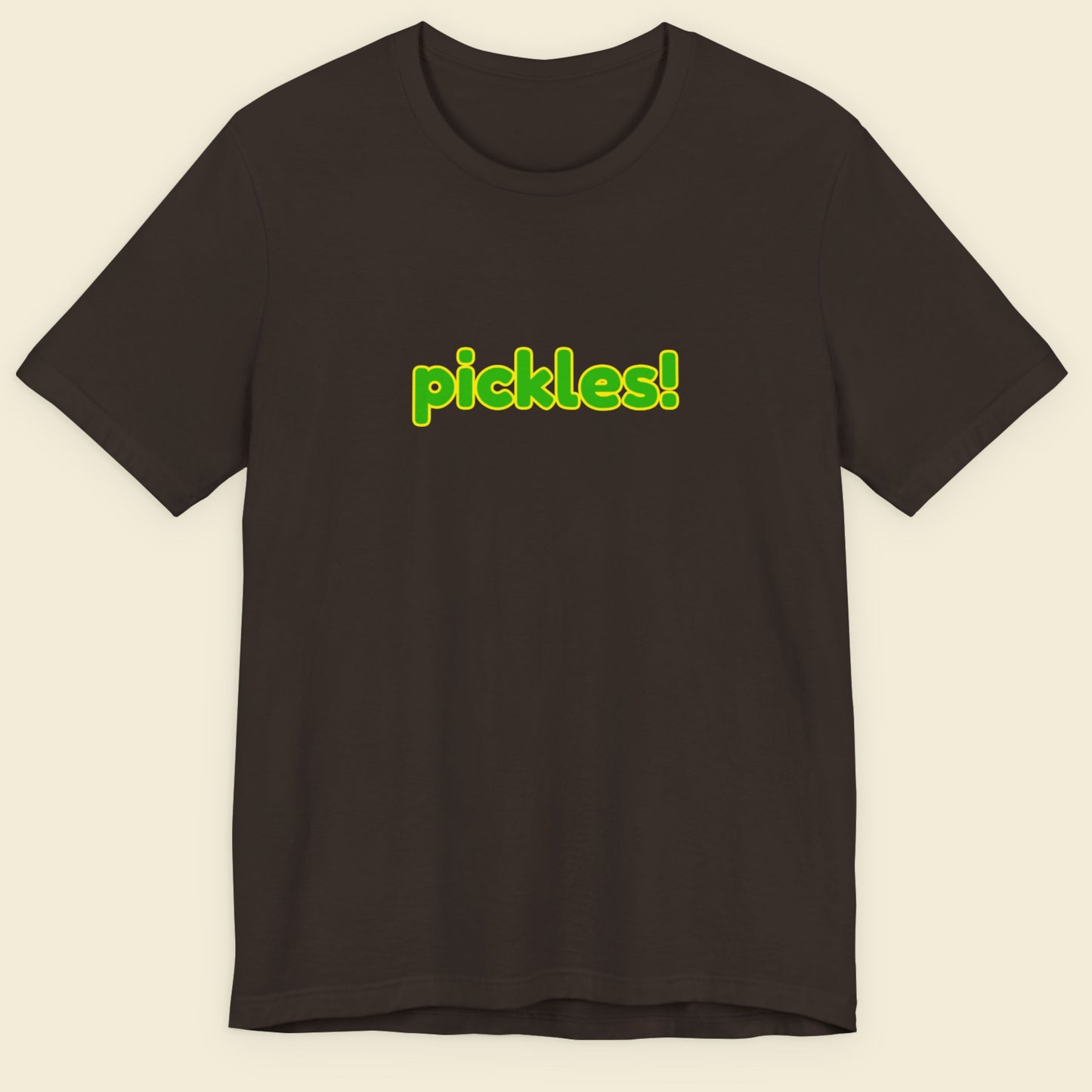 Brown t-shirt with humorous colorful pickles! text on a beige background.