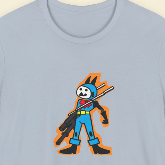 Light blue t-shirt with a fun, colorful cartoon hero illustration on a beige background.