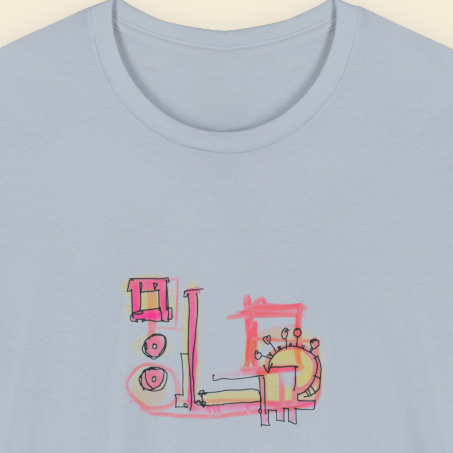 Light blue t-shirt with a colorful abstract graffiti drawing on a beige background.