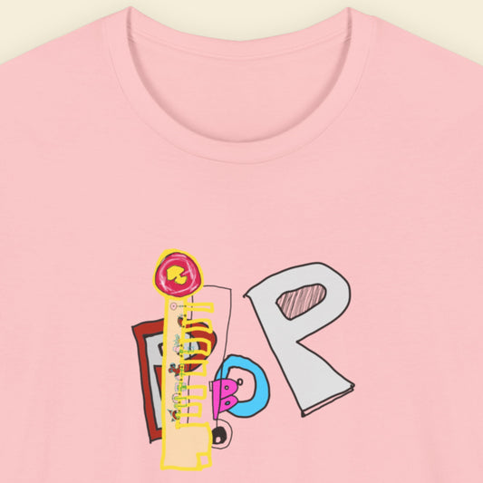 Pink t-shirt with a colorful abstract trash graff drawing on a beige background.