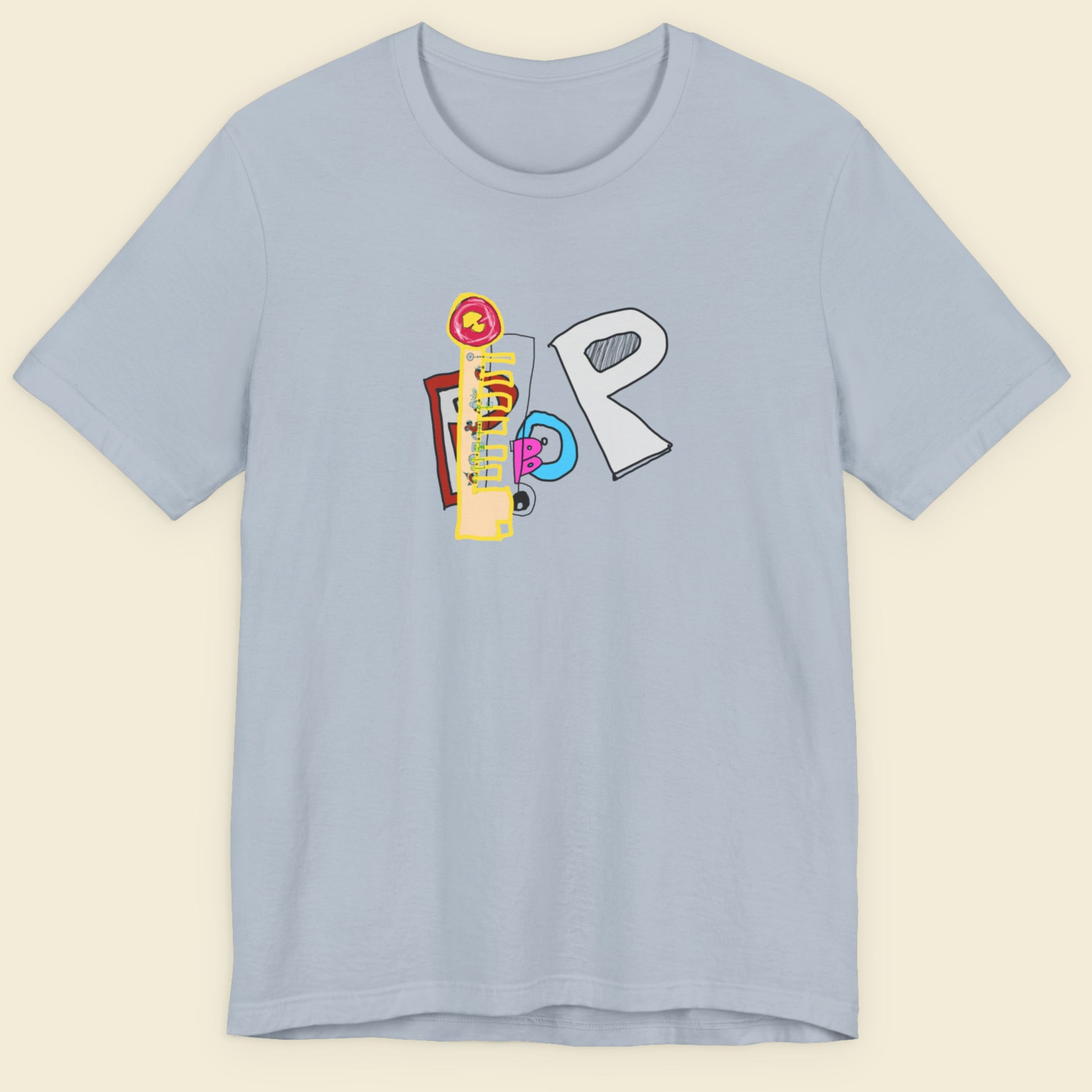 Light blue t-shirt with colorful graphic design on a beige background