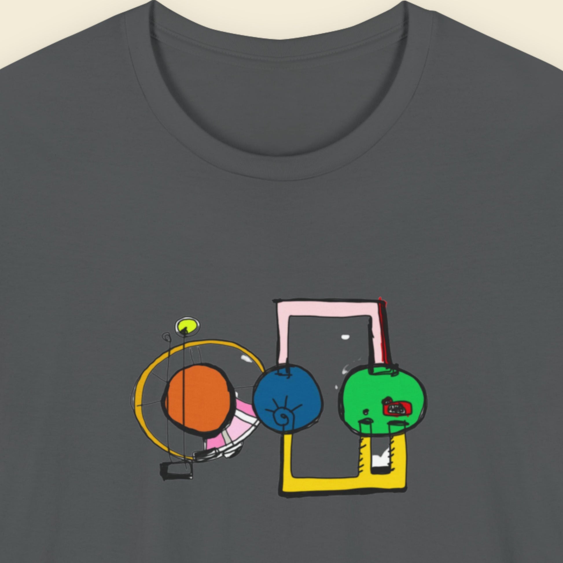 Grey t-shirt with a colorful abstract drawing on a beige background.