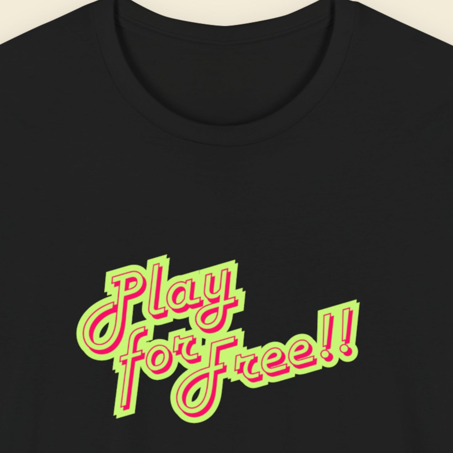 Black t-shirt with red and green text on a beige background.