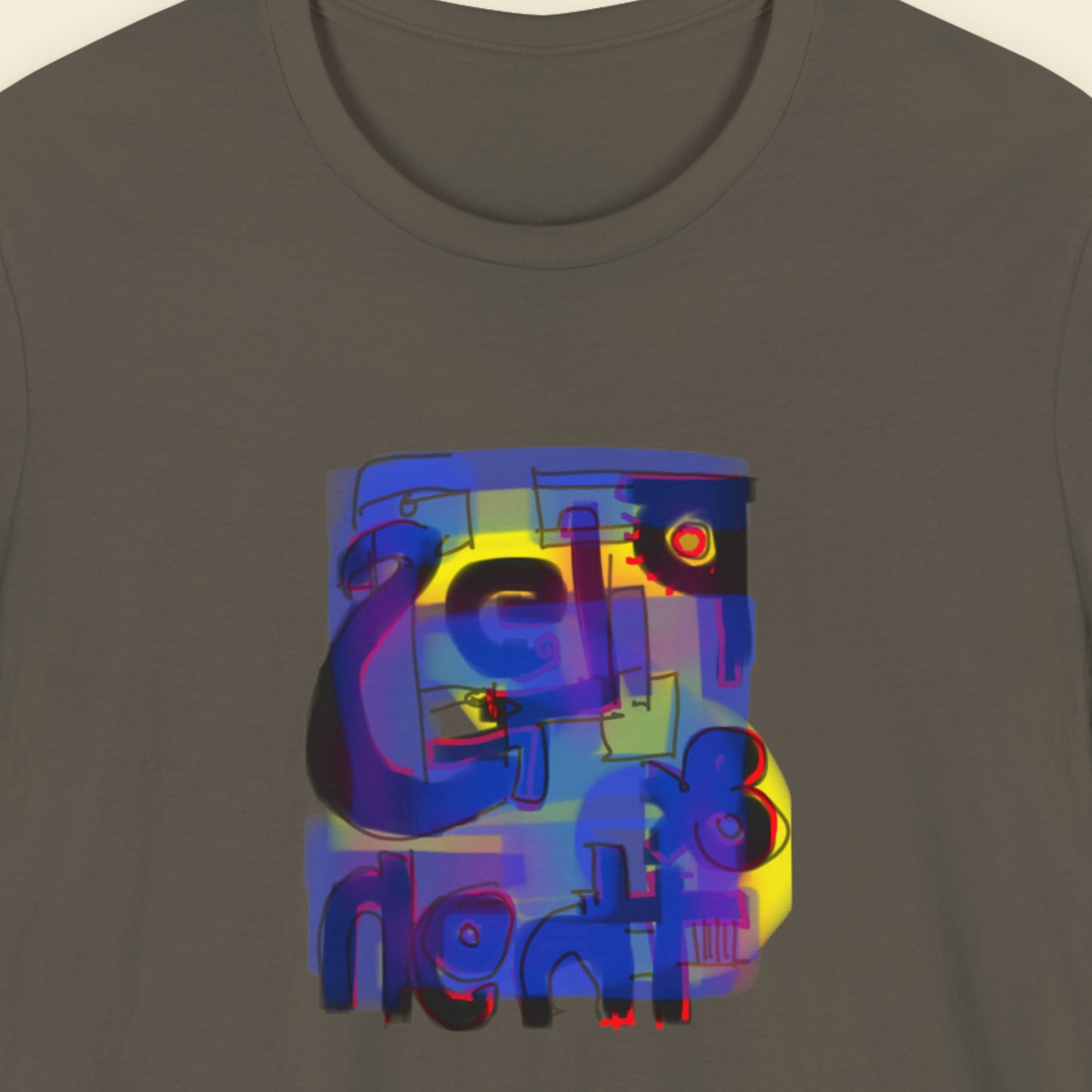 Army green t-shirt with a colorful abstract drawing on a beige background.
