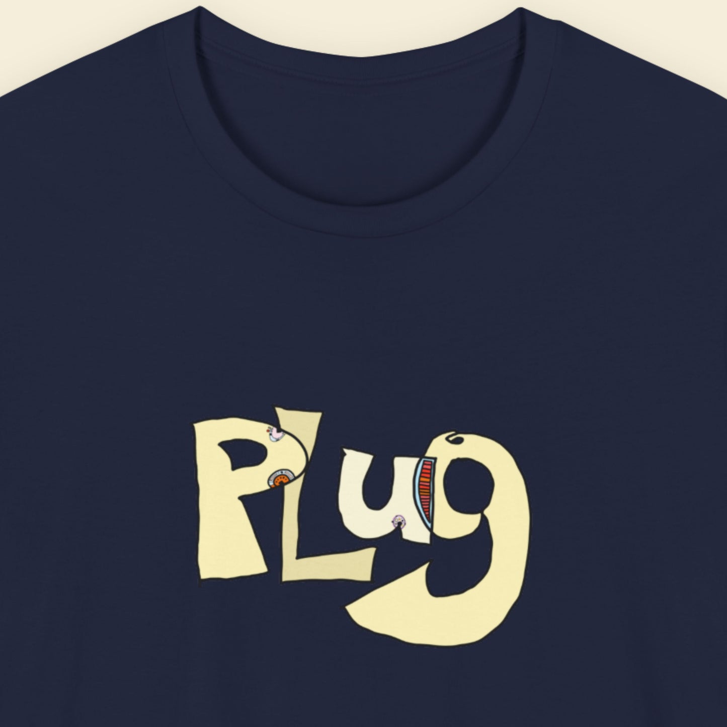 Navy blue t-shirt with a colorful abstract graffiti drawing on a beige background.