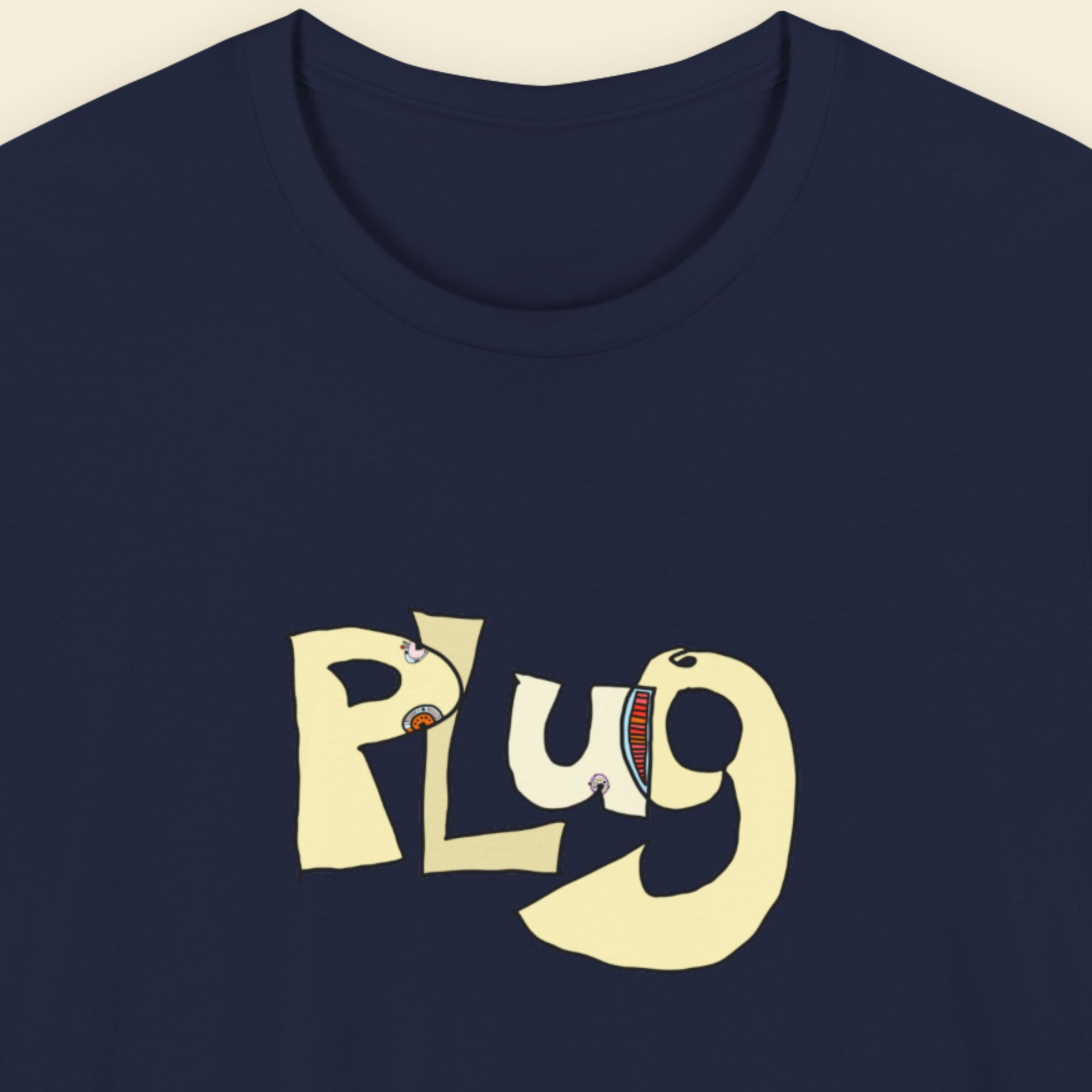 Navy blue t-shirt with a colorful abstract graffiti drawing on a beige background.