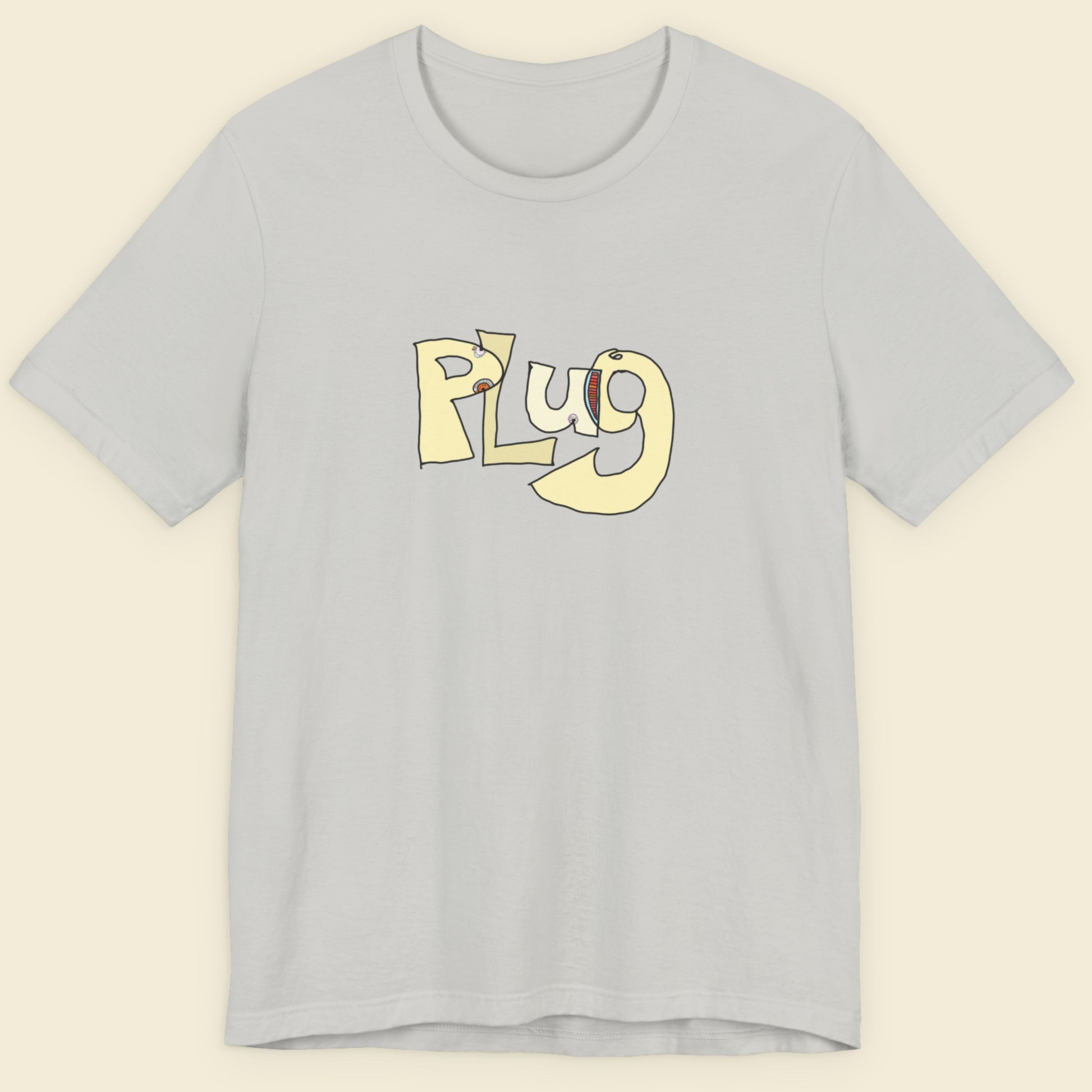Light grey blue t-shirt with a colorful abstract graffiti drawing on a beige background.