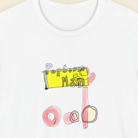 White t-shirt with a colorful abstract graffiti style drawing on a beige background.