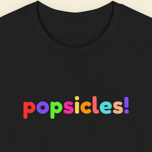 Black t-shirt with humorous colorful text on a beige background.