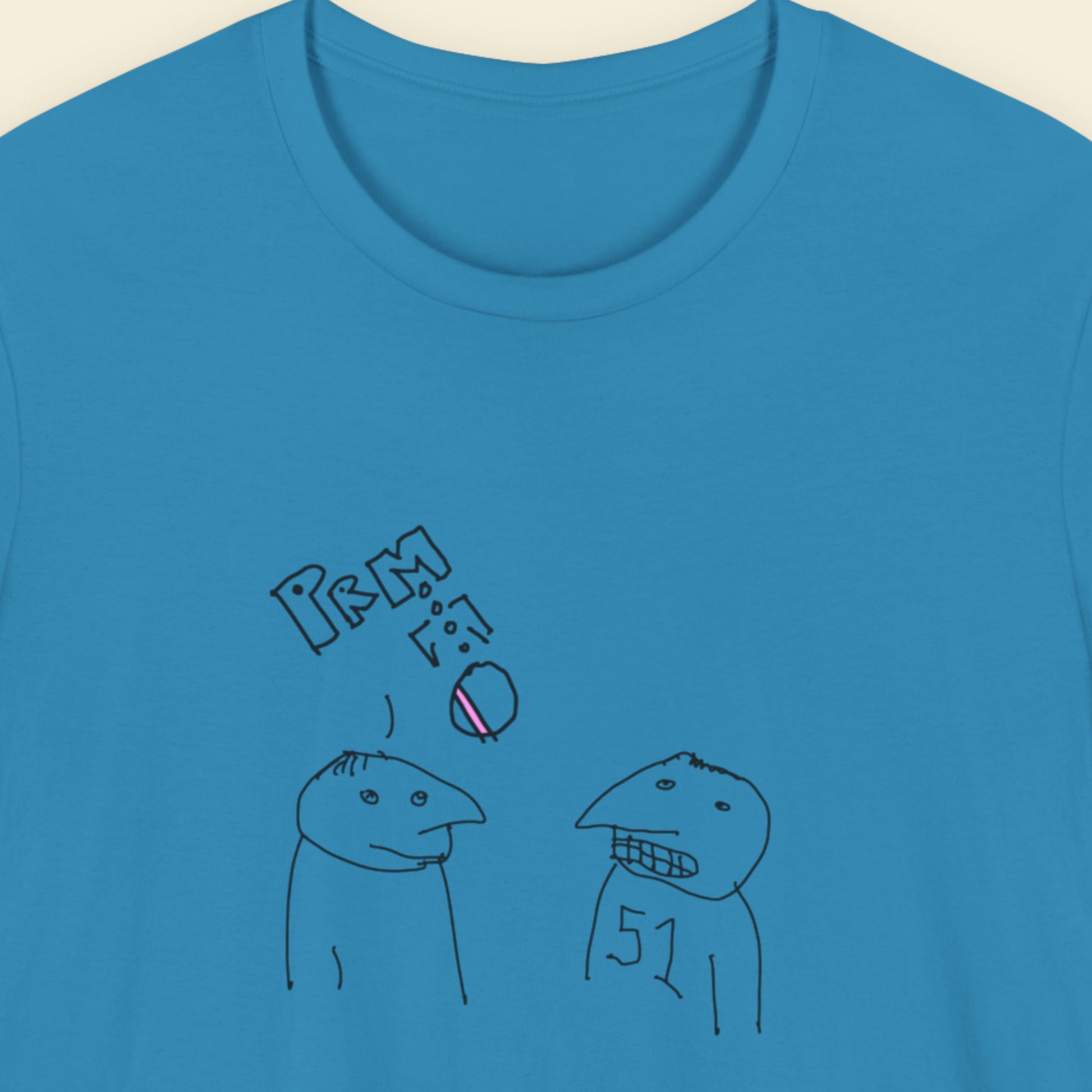 Aqua blue t-shirt with a colorful abstract drawing on a beige background.