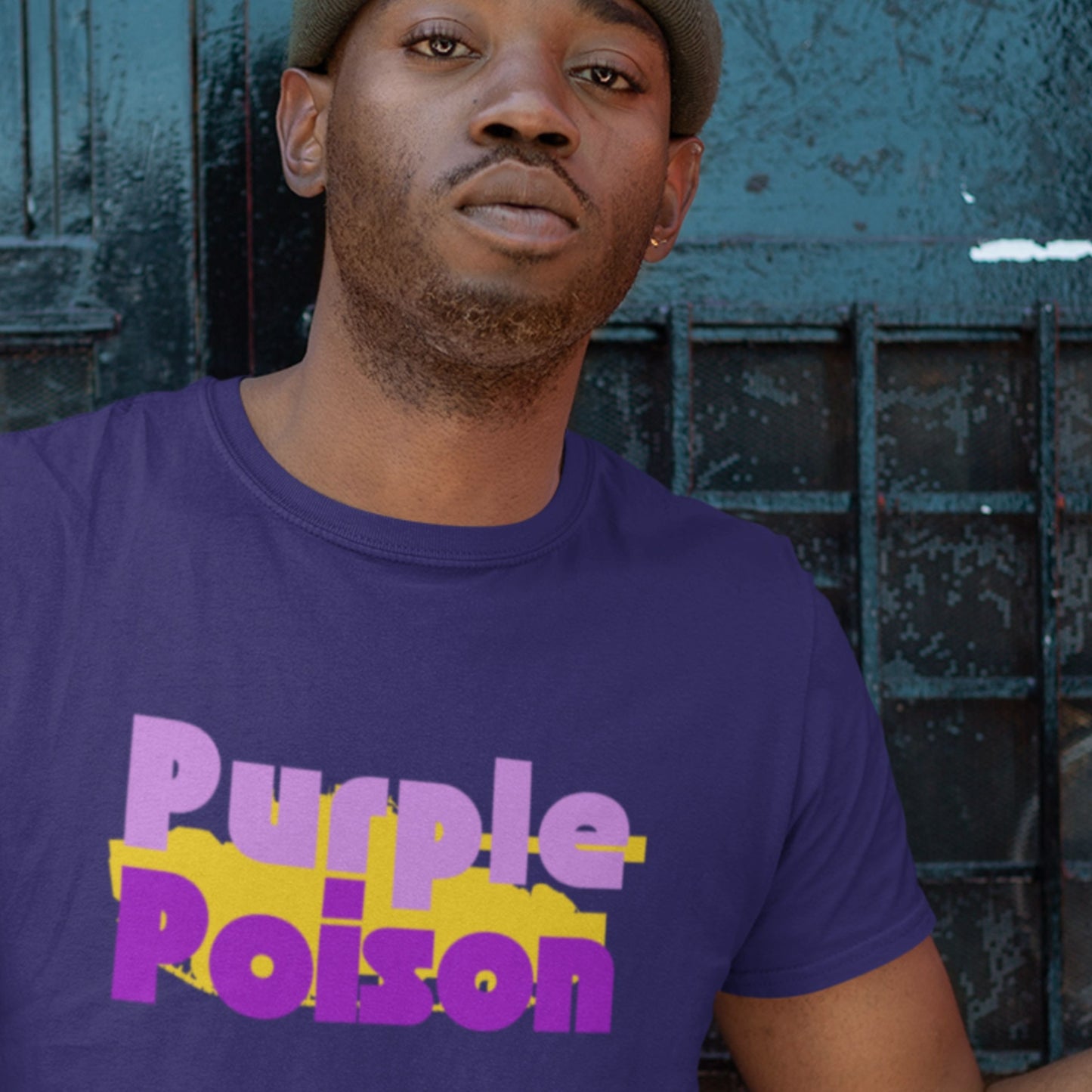 Person wearing a purple t-shirt with 'Purple Poison' text against a dark background.