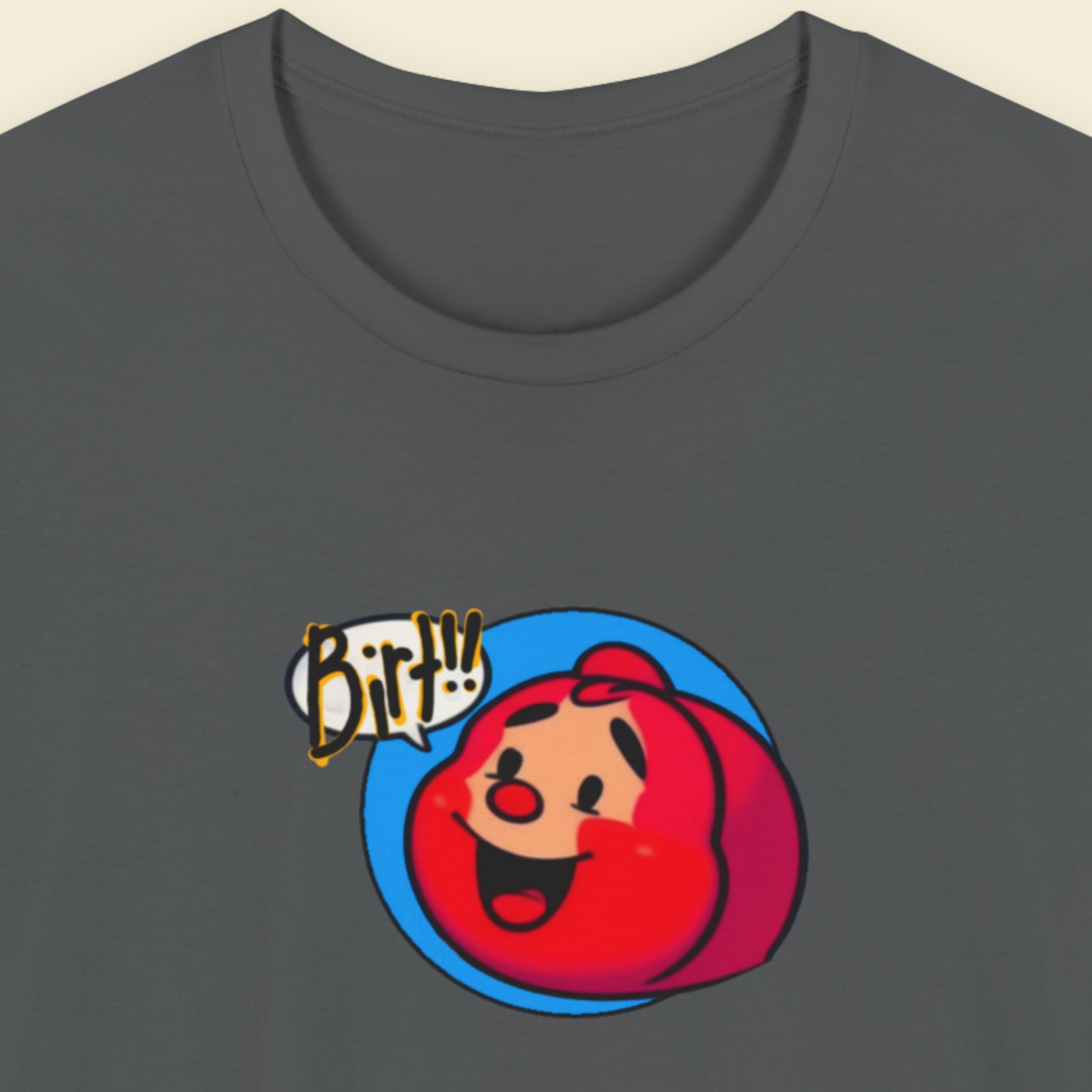 Grey t-shirt with a fun, colorful cartoon illustration on a beige background.