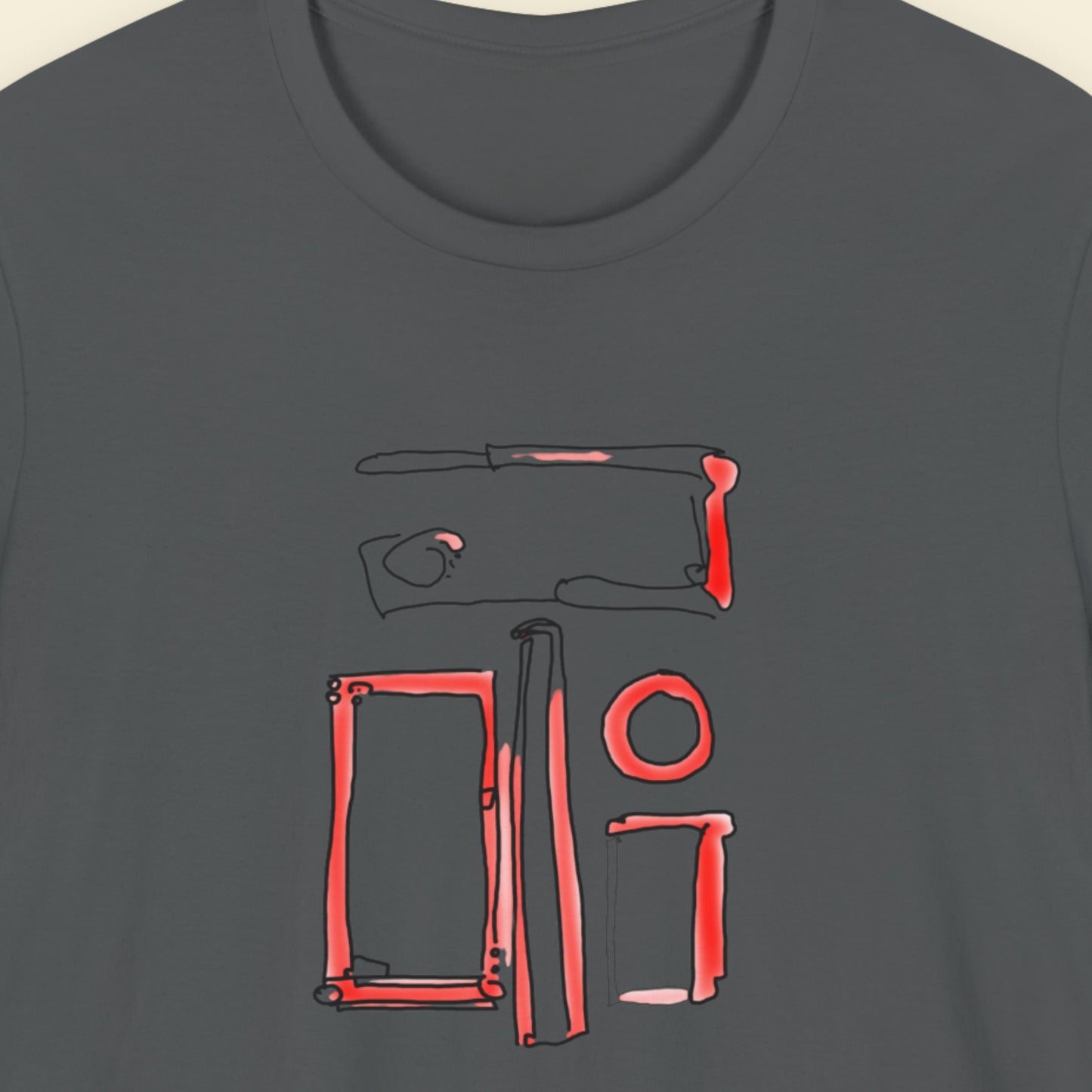 Dark grey t-shirt with a colorful abstract drawing on a beige background.