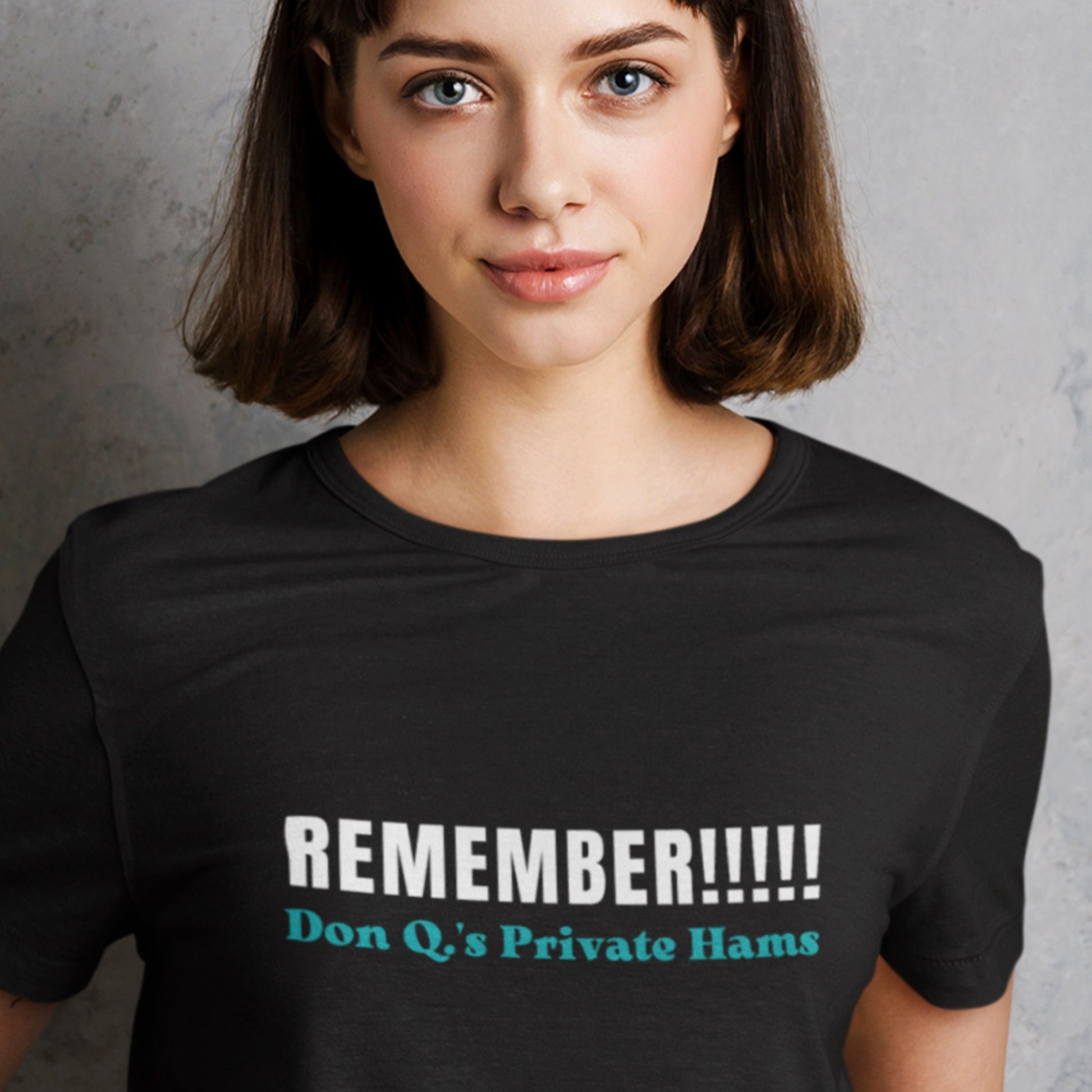 Person wearing a black t-shirt with humorous text design.