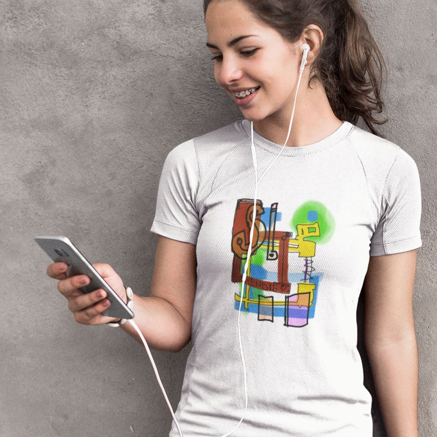 Woman wearing a white t-shirt with a colorful abstract drawing on a grey background.
