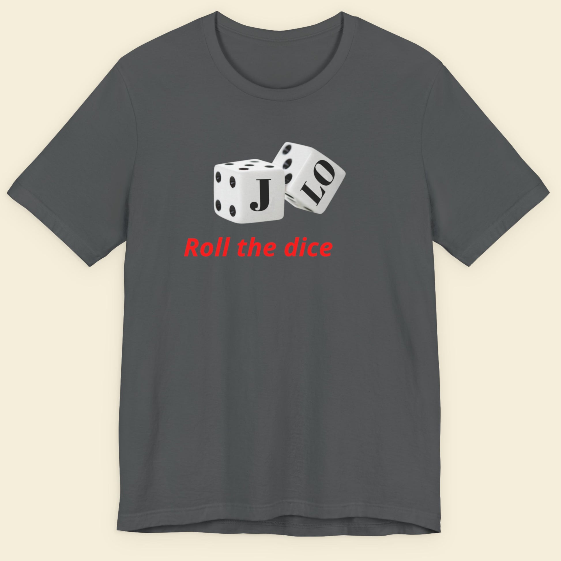 Gray t-shirt with dice design and text 'Roll the dice' on a beige background.