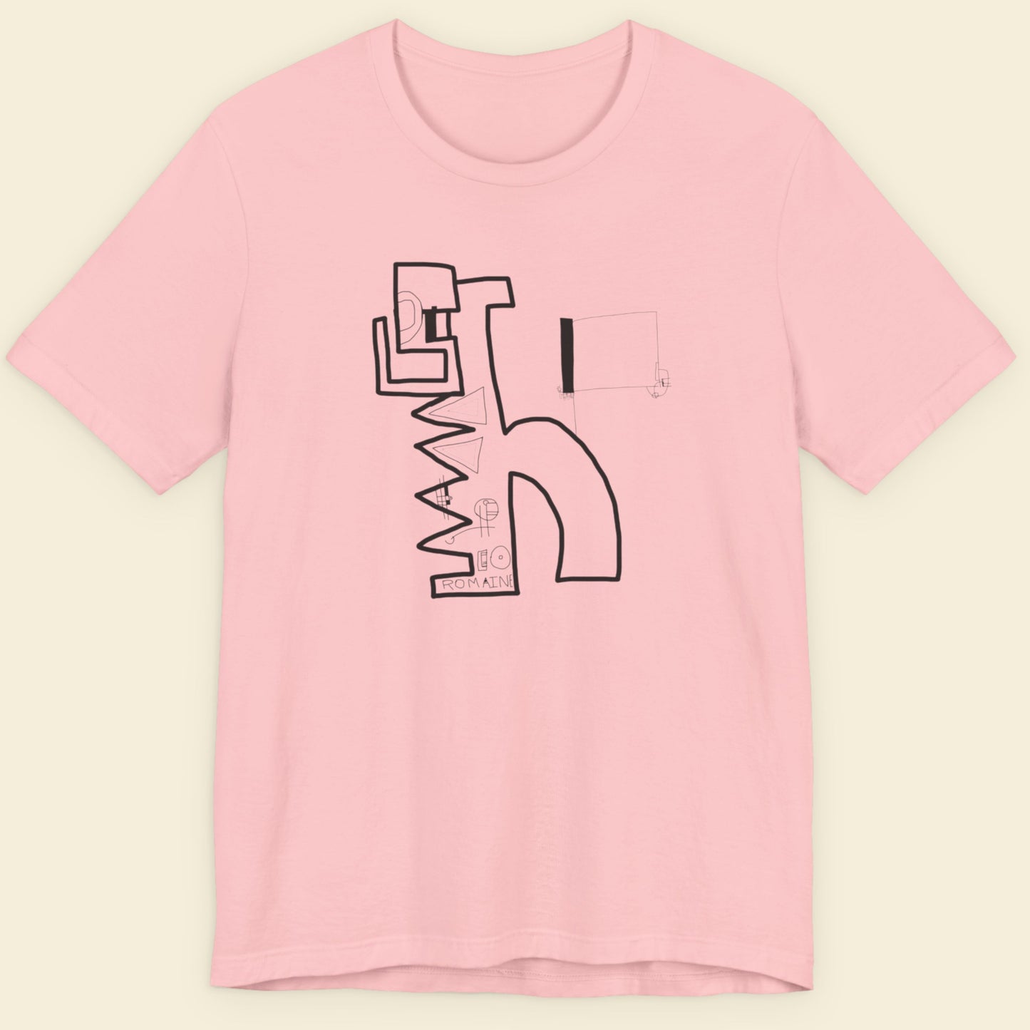 Pink t-shirt with black abstract design on a beige background.