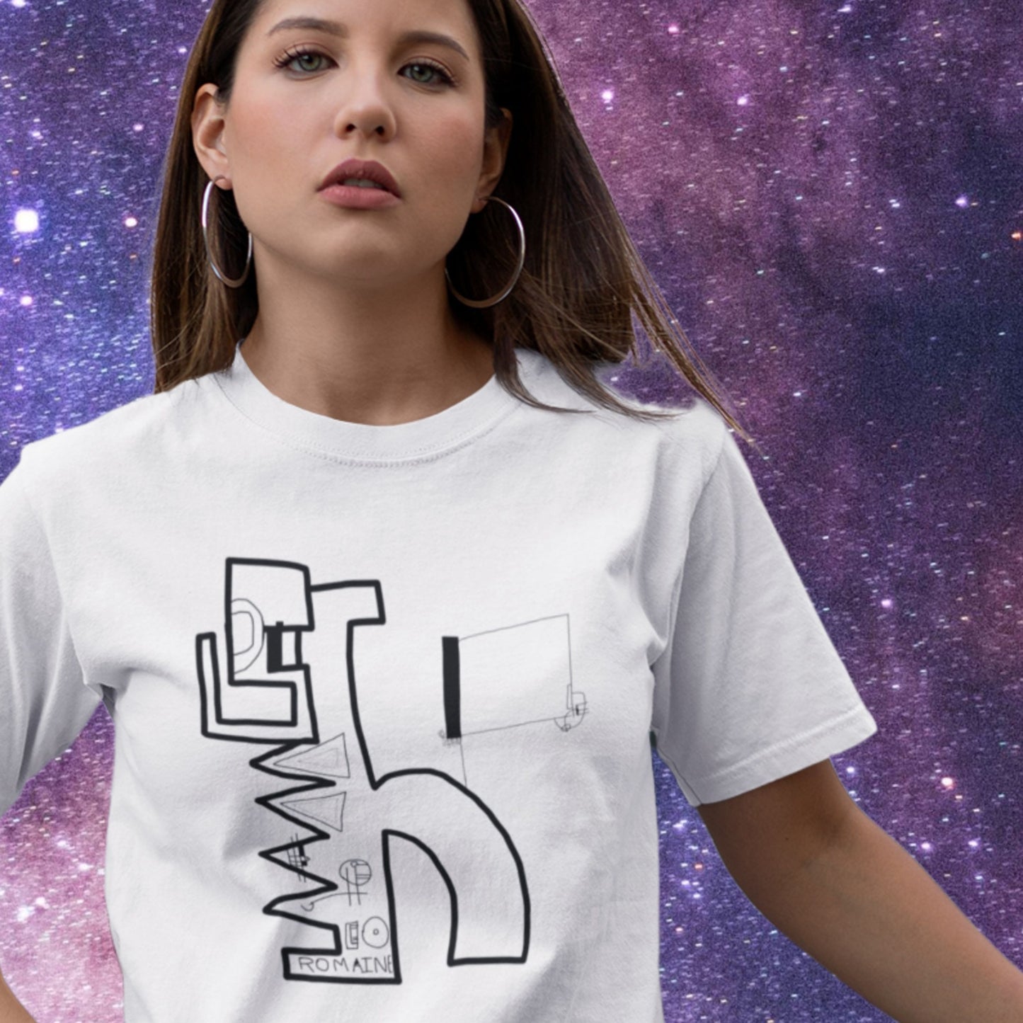 Woman wearing a white t-shirt with black graphic design against a starry space background.