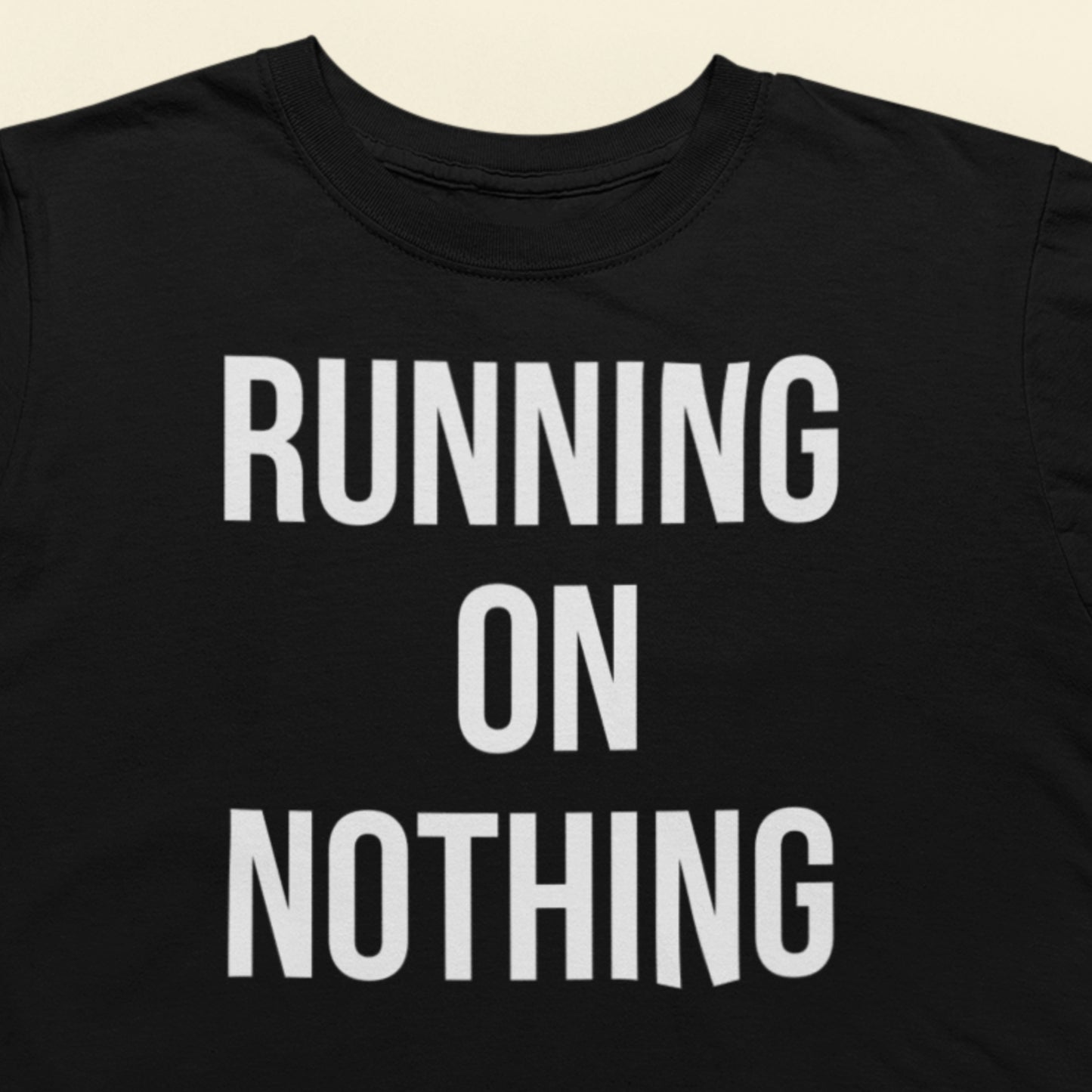 Running on nothing text t-shirt black minimalist design closeup