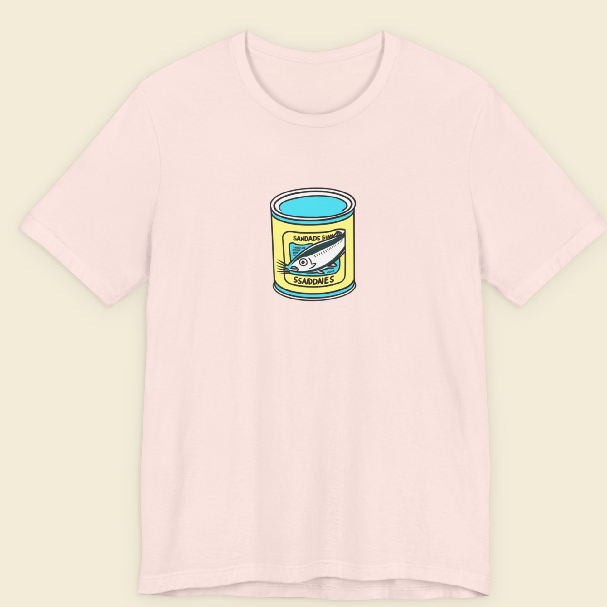 pink shirt with a can of fish design on a beige background.