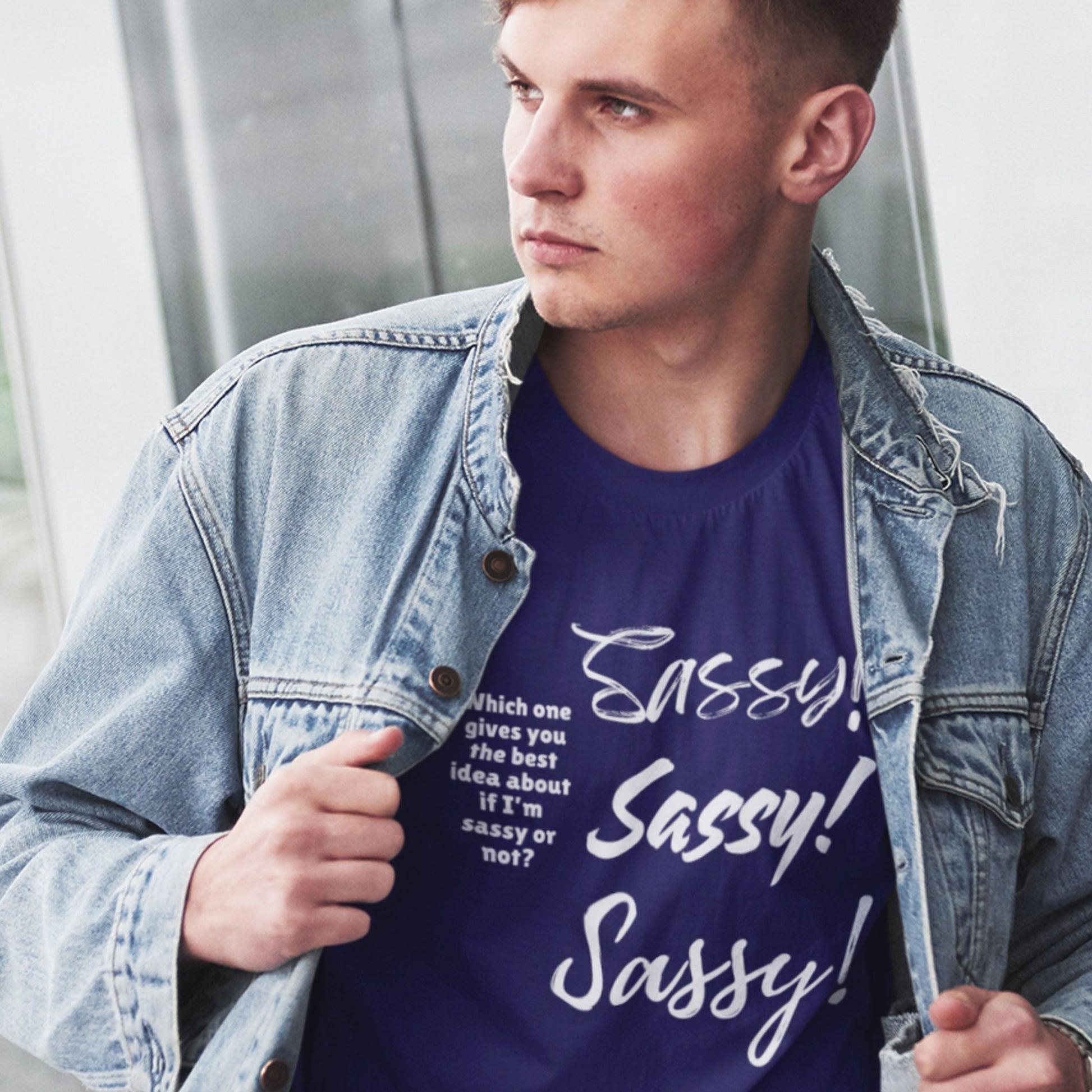 Man wearing a denim jacket over a purple t-shirt with 'Sassy! Sassy! Sassy!' text.