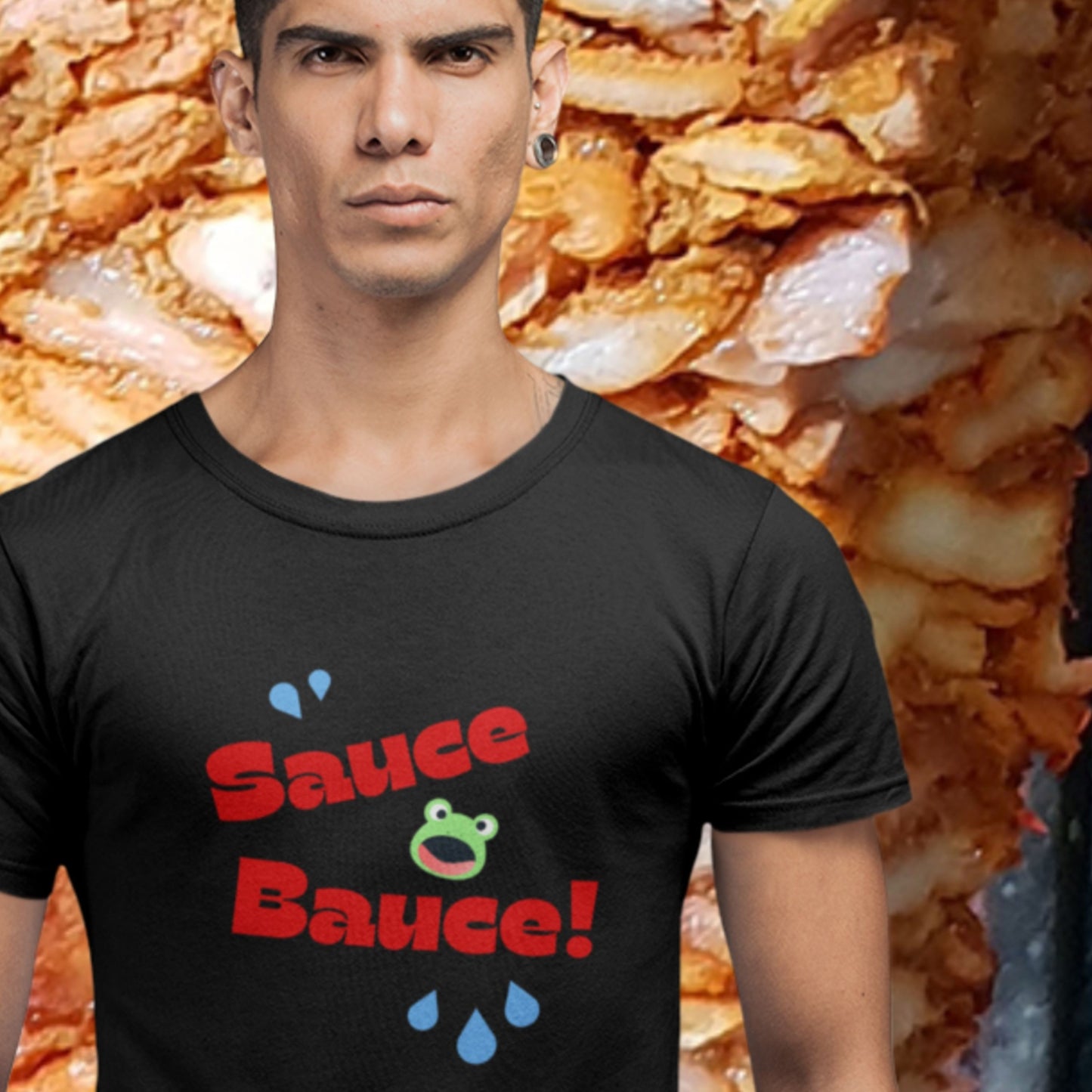 Person wearing a black t-shirt with 'Sauce Bauce!' text in front of a shawarma background.
