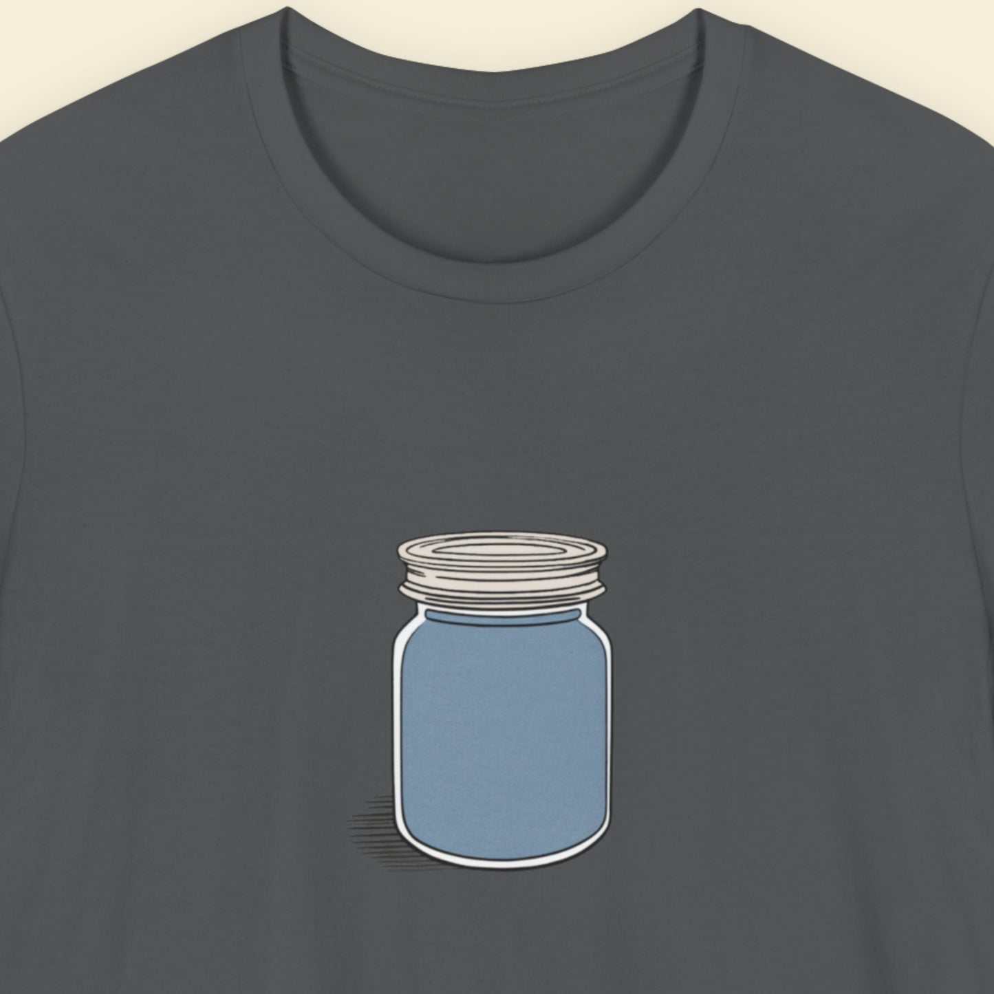 Dark grey shirt with a drawing of a screw top jar full of something blue.