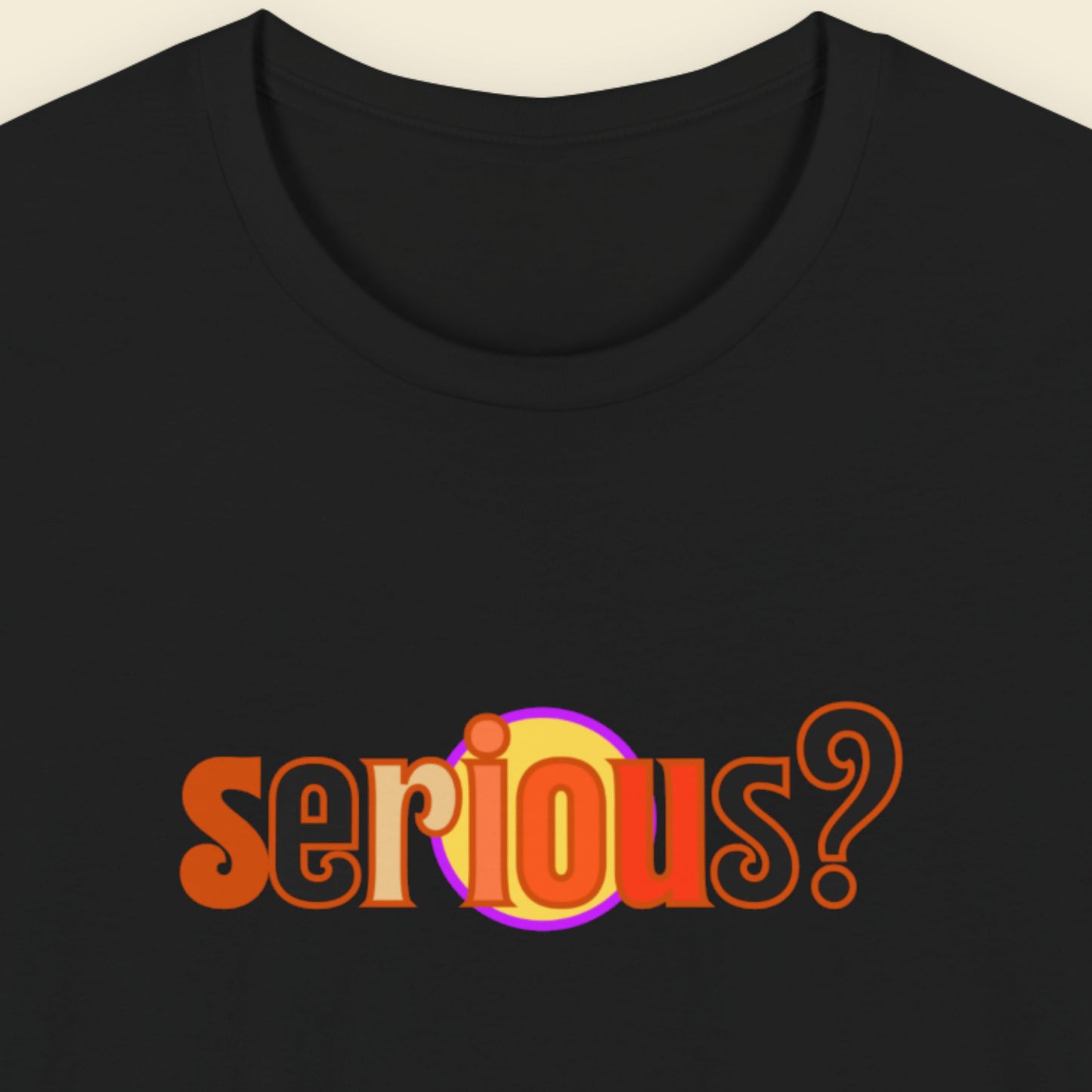 Black t-shirt with multicolored 'serious?' text on a beige background.