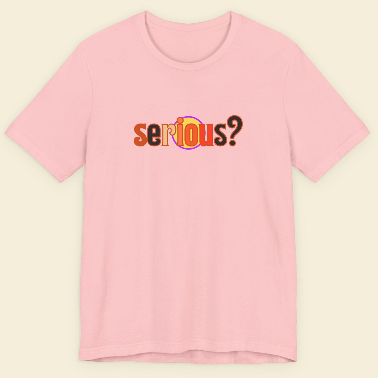 Pink t-shirt with 'serious?' text on a beige background.