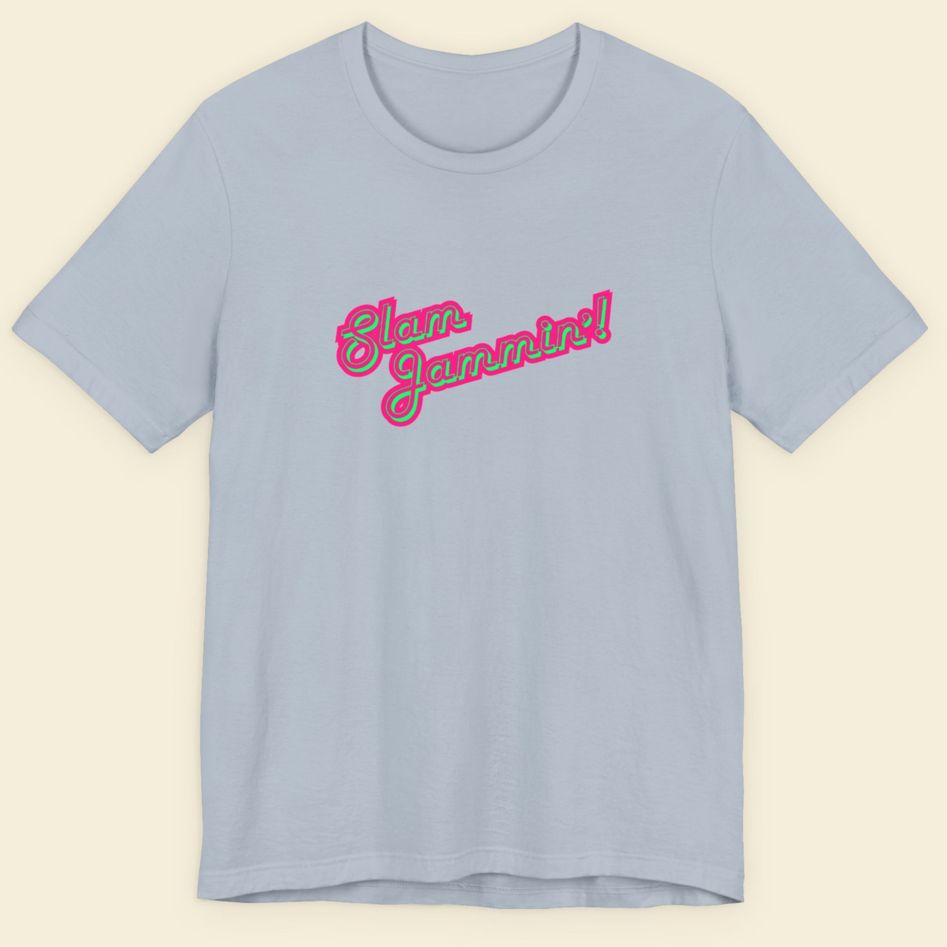 Light blue tee with multi-colored humorous text on a beige background.