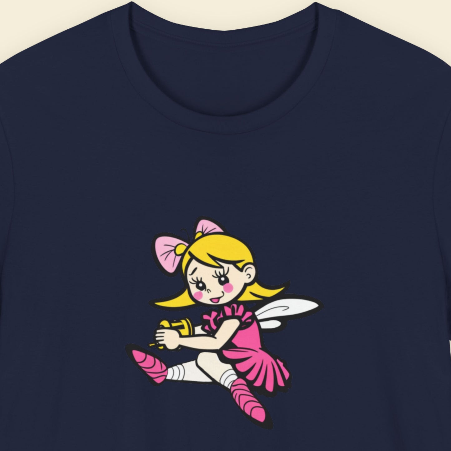 Navy blue t-shirt with a fun, colorful cartoon fairy illustration on a beige background.