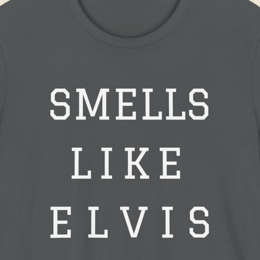 Gray t-shirt with 'SMELLS LIKE ELVIS' text in white on a plain background.