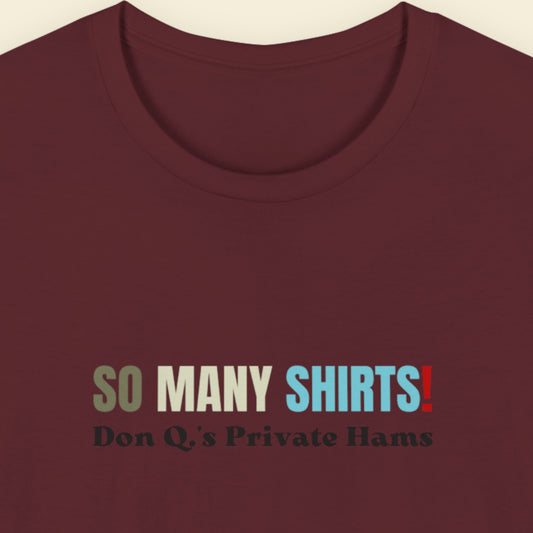 Maroon shirt with multicolored 'so many shirts!' text on a beige background.