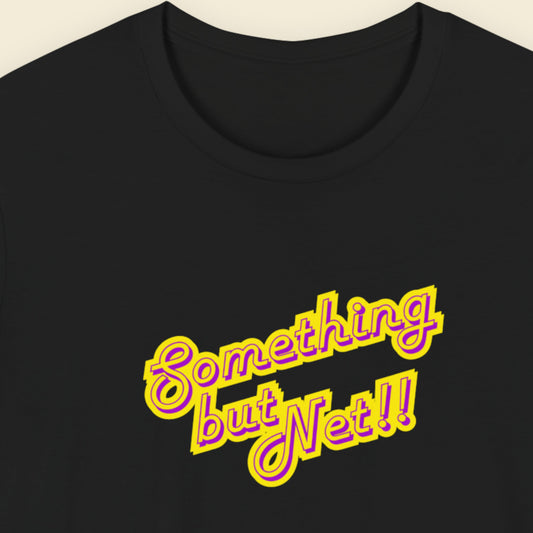 Black t-shirt with humorous colorful text on a beige background.