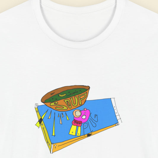 White t-shirt with a colorful abstract drawing on a beige background.