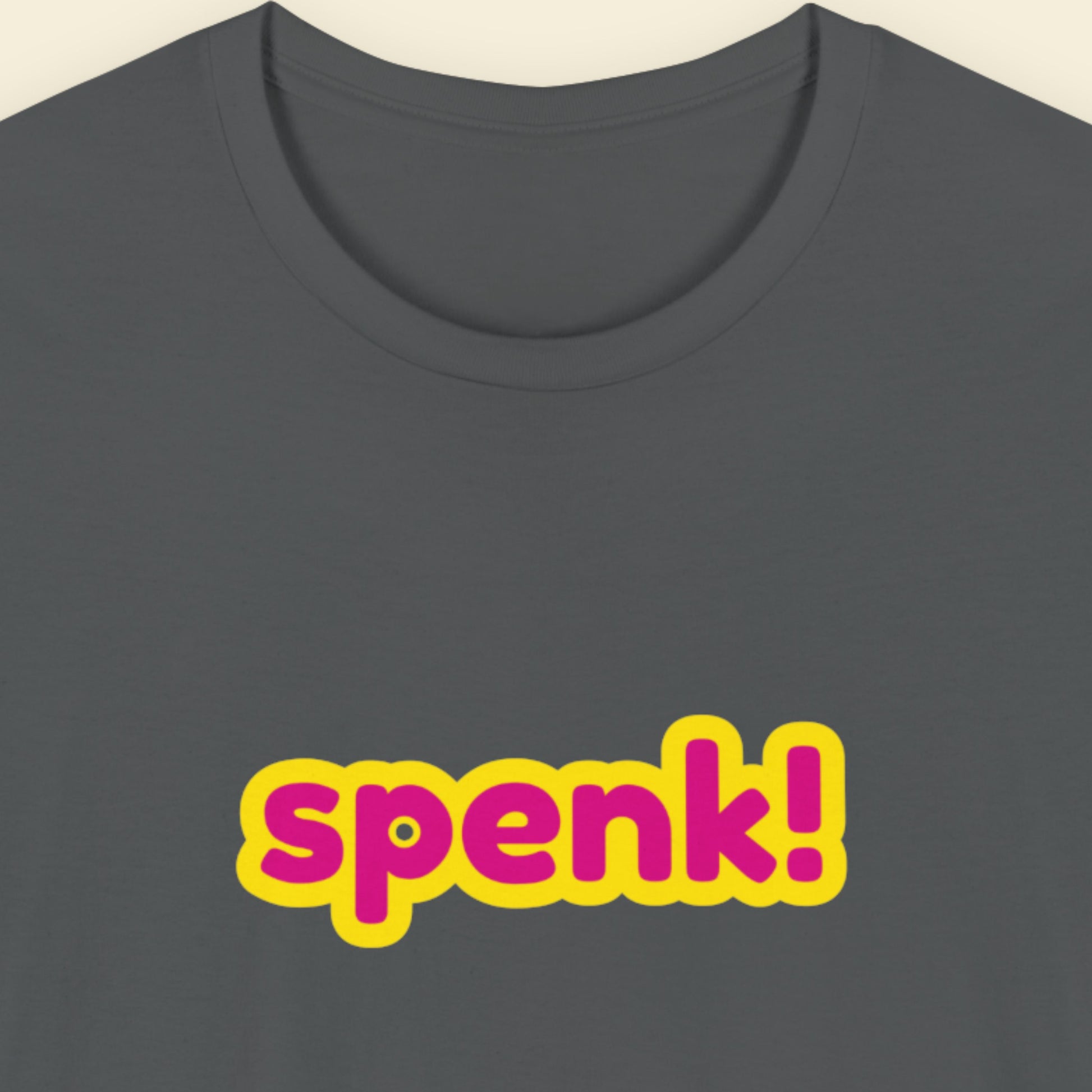 Grey t-shirt with multicolored 'spenk!' text on a beige background.