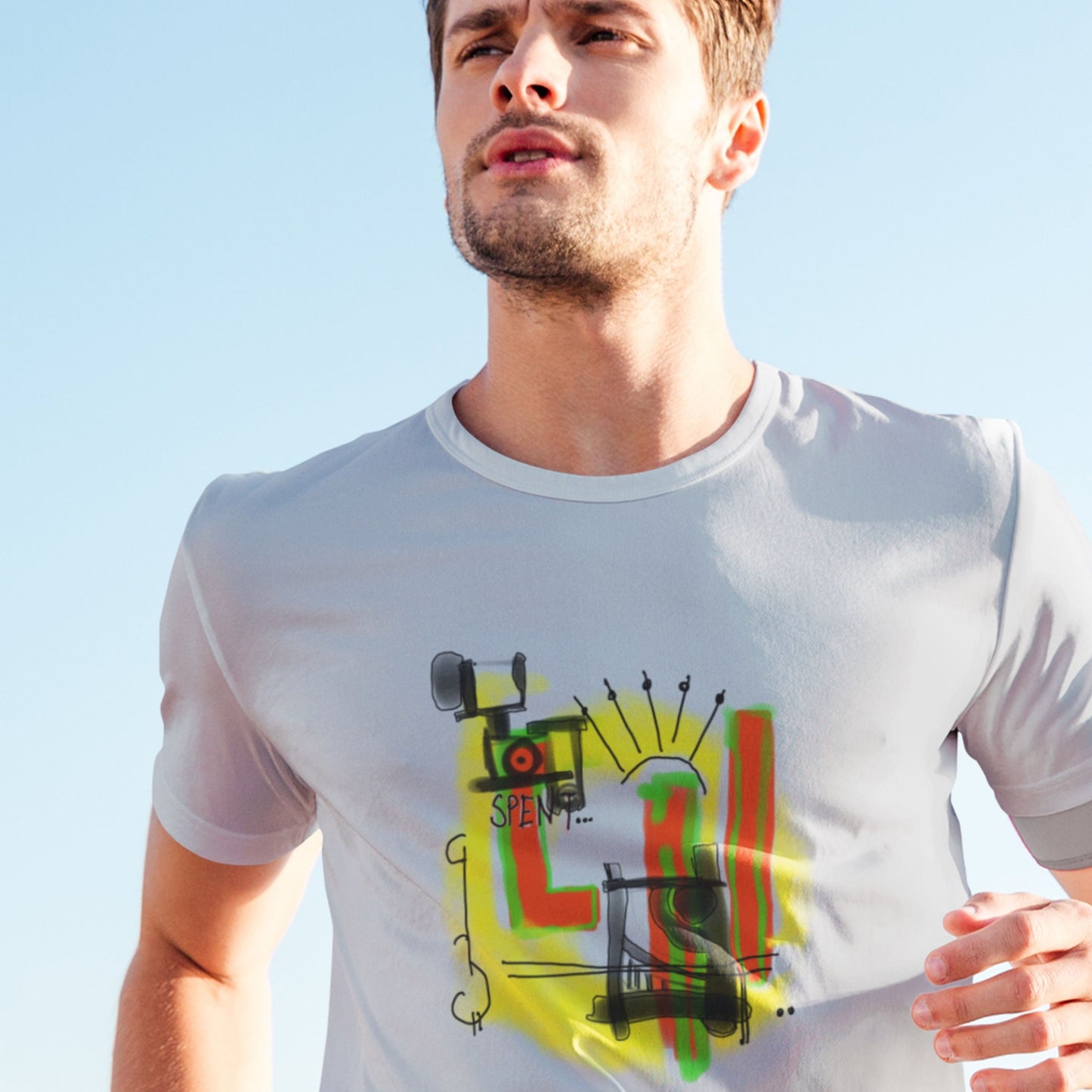 Man running a light grey t-shirt with a colorful abstract drawing outdoors.