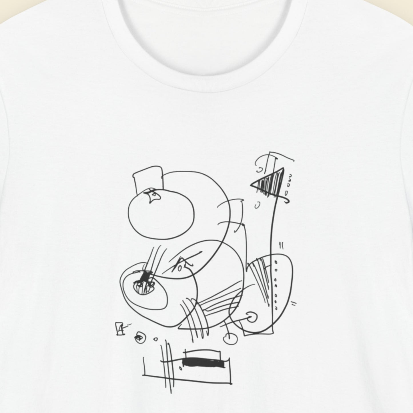White t-shirt with an abstract line drawing on a beige background.