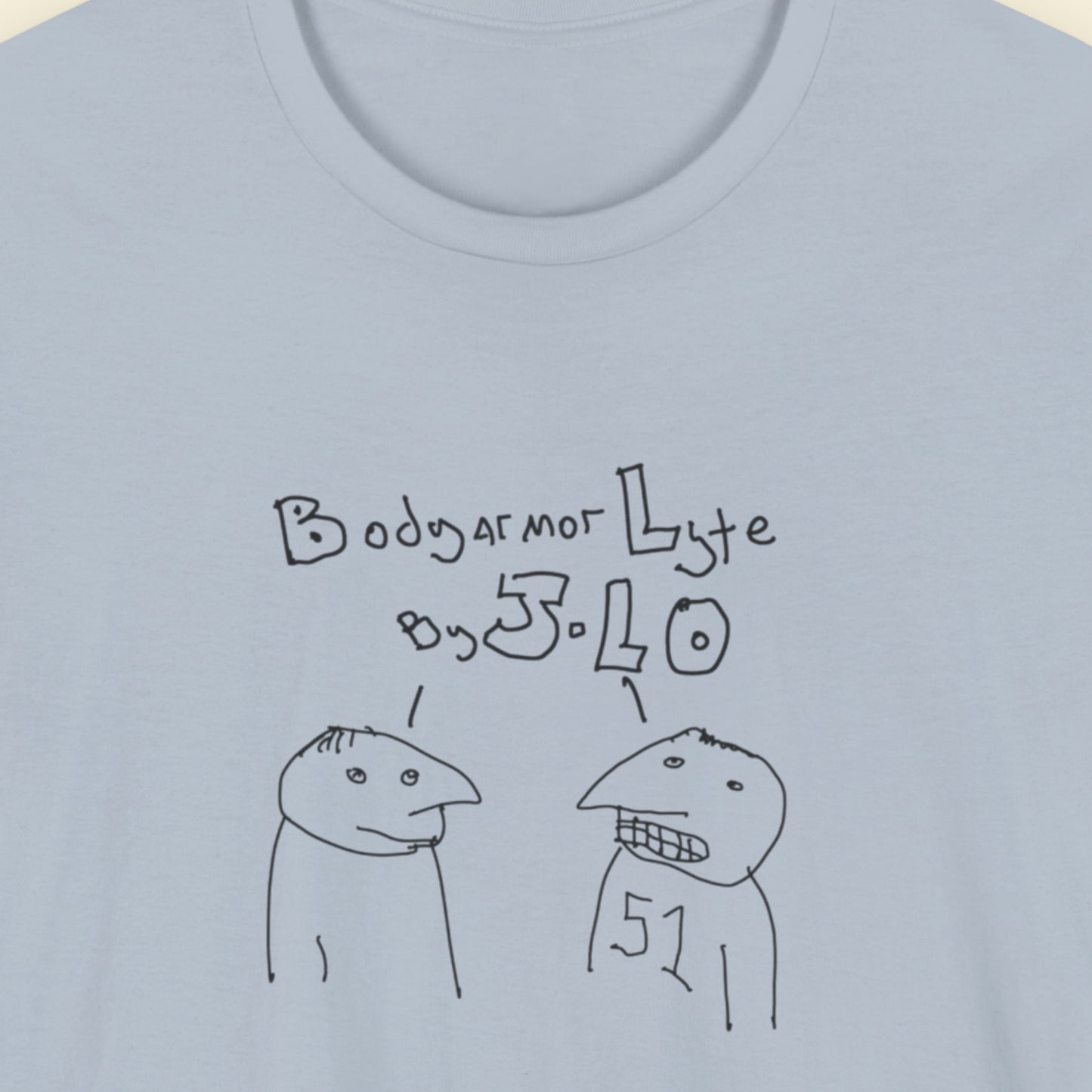 Light blue t-shirt with a line drawing on a beige background.