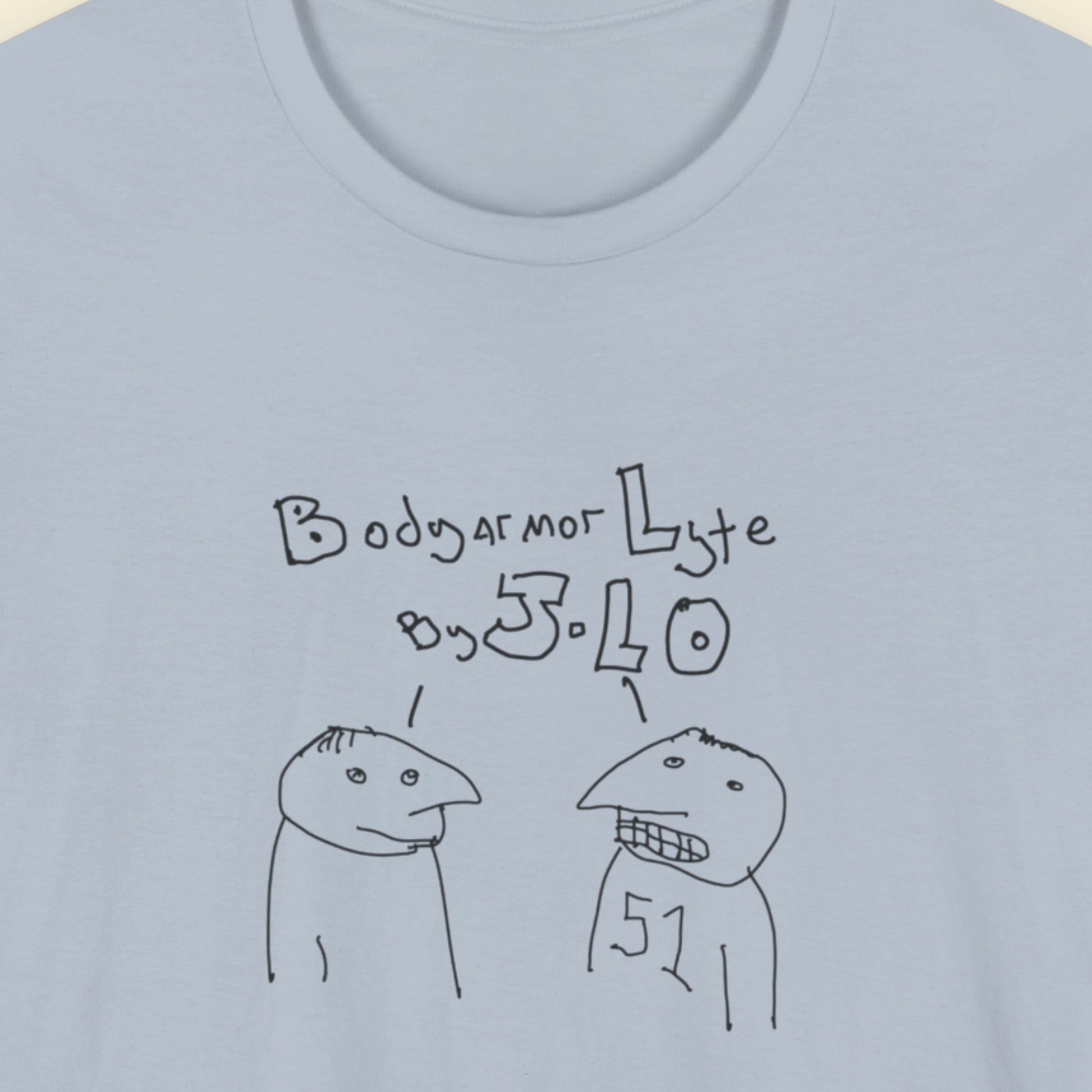 Light blue t-shirt with a line drawing on a beige background.